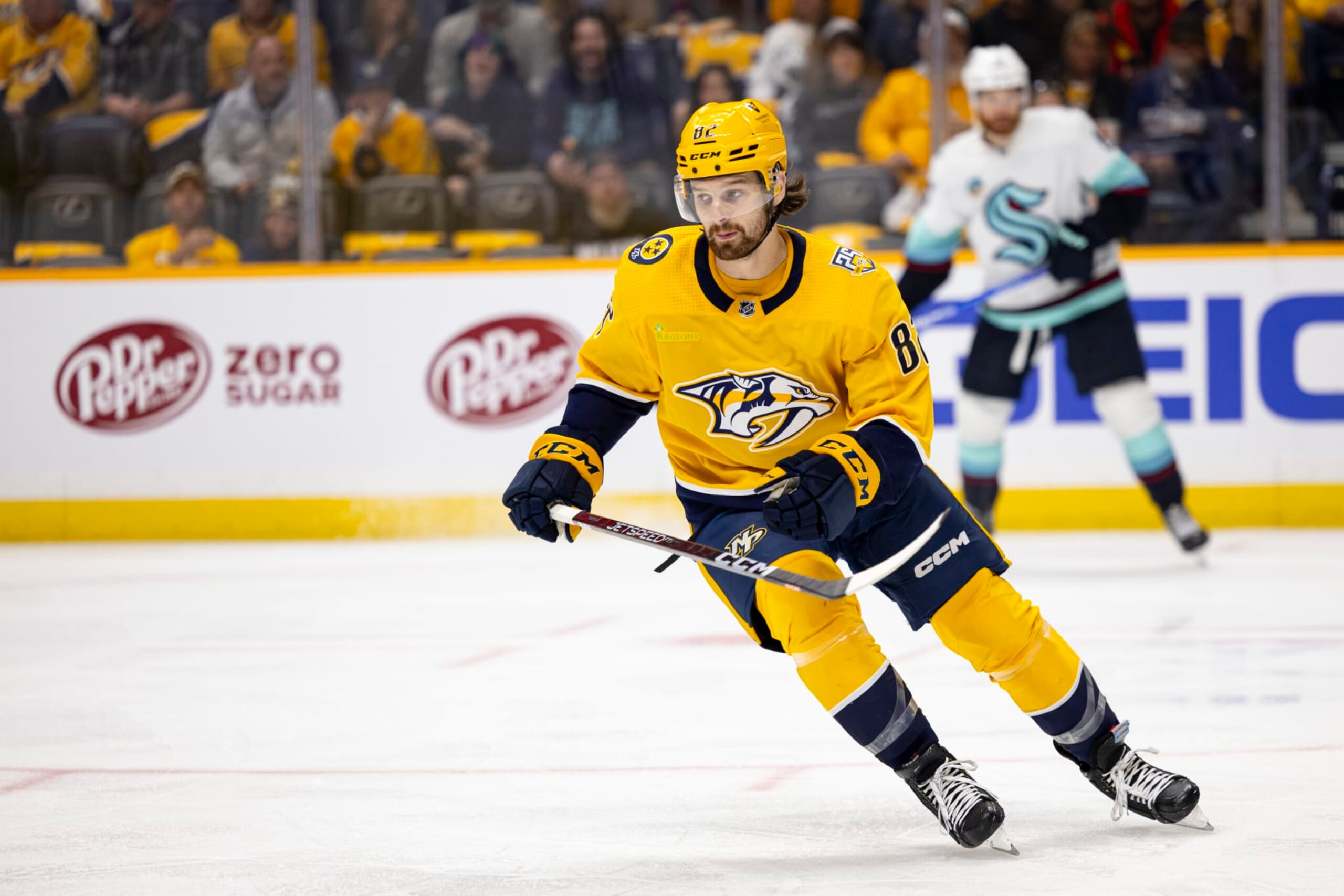 NASHVILLE, TENNESSEE - OCTOBER 12:  Tommy Novak #82 of the Nashville Predators skates against the Seattle Kraken during the first period at Bridgestone Arena on October 12, 2023 in Nashville, Tennessee. Nashville defeats Seattle 3-0. (Photo by Brett Carlsen/Getty Images)