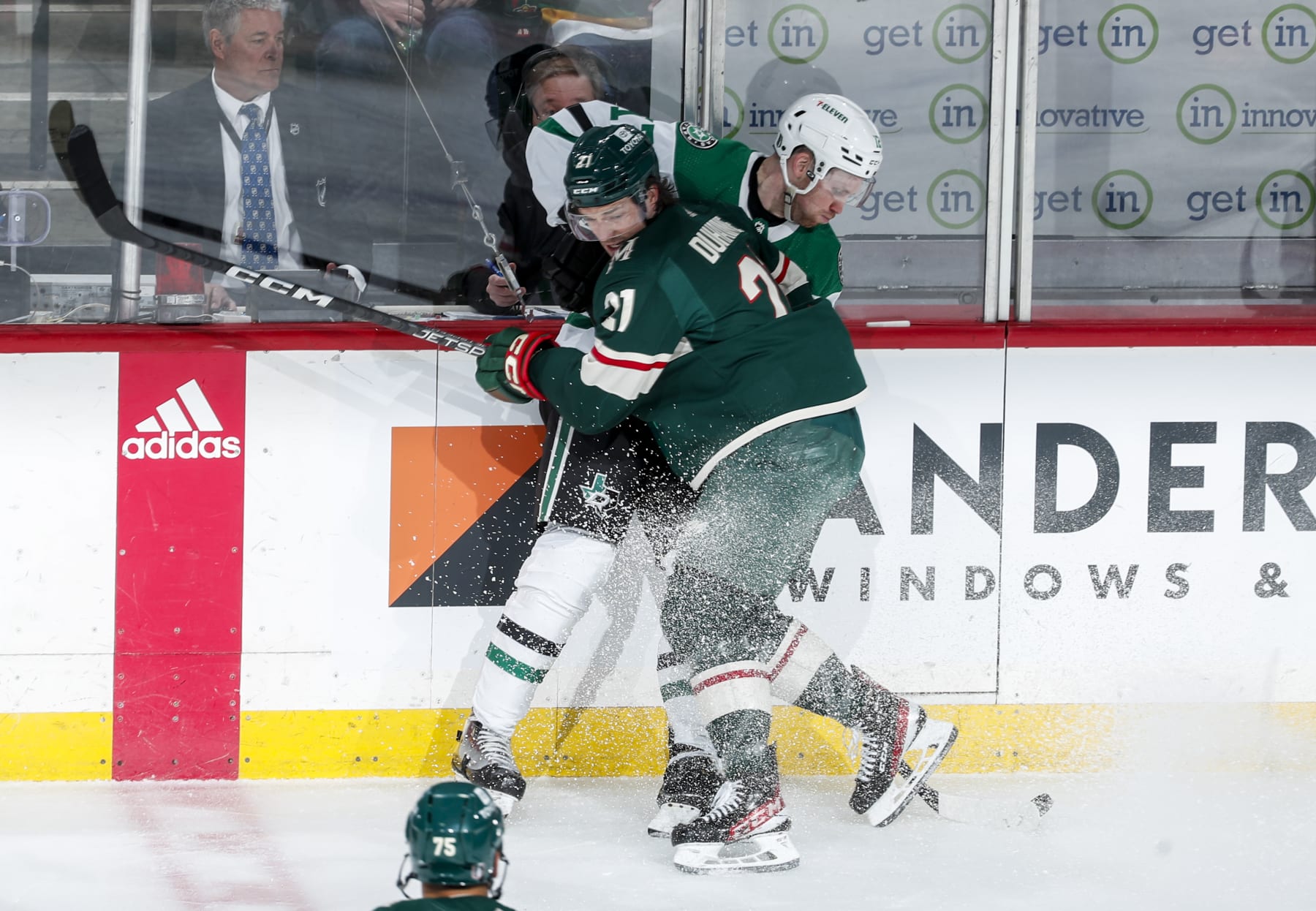 ST PAUL, MN - APRIL 21: Brandon Duhaime #21 of the Minnesota Wild checks Radek Faksa #12 of the Dallas Stars against the boards in the second period of Game Three of the First Round of the 2023 Stanley Cup Playoffs at Xcel Energy Center on April 21, 2023 in St Paul, Minnesota. (Photo by Bruce Kluckhohn/NHLI via Getty Images)