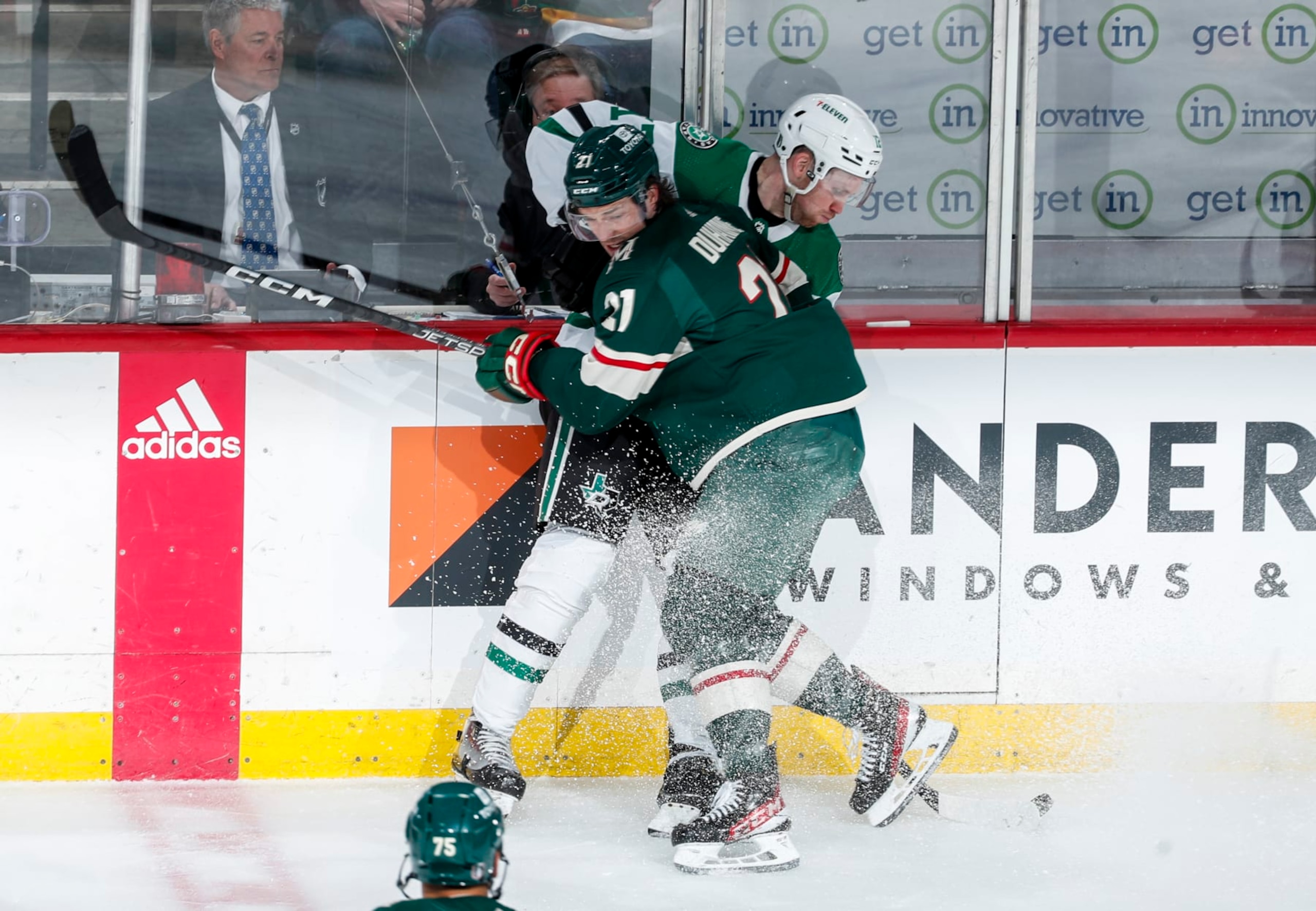 ST PAUL, MN - APRIL 21: Brandon Duhaime #21 of the Minnesota Wild checks Radek Faksa #12 of the Dallas Stars against the boards in the second period of Game Three of the First Round of the 2023 Stanley Cup Playoffs at Xcel Energy Center on April 21, 2023 in St Paul, Minnesota. (Photo by Bruce Kluckhohn/NHLI via Getty Images)
