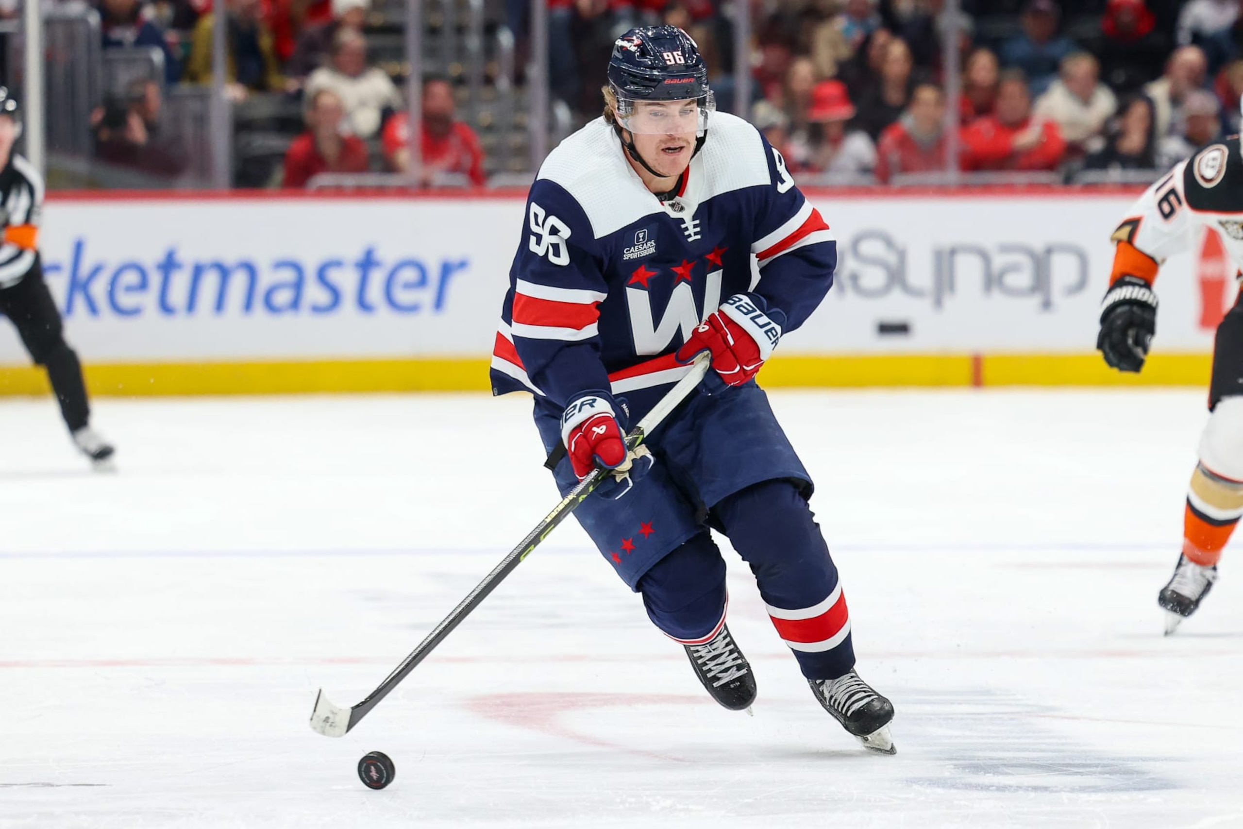 WASHINGTON, DC - JANUARY 16: Nicolas Aube-Kubel #96 of the Washington Capitals carries the puck up the ice during a game against the Anaheim Ducks at Capital One Arena on January 16, 2024 in Washington, D.C. (Photo by John McCreary/NHLI via Getty Images)