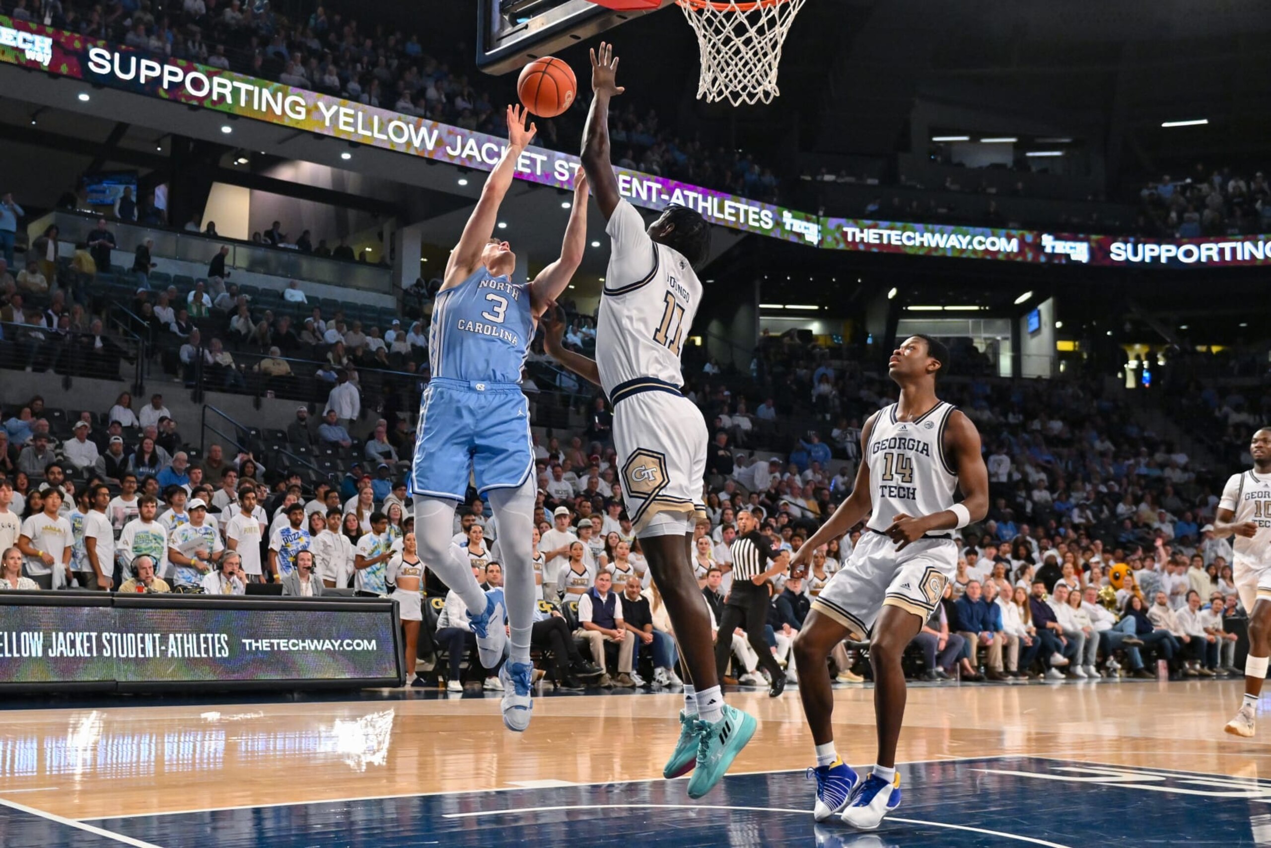 ATLANTA, GA  JANUARY 30:  North Carolina guard Cormac Ryan (3) drives to the basket against Georgia Tech forward Baye Ndongo (11) during the college basketball game between the North Carolina Tar Heels and the Georgia Tech Yellow Jackets on January 30th, 2024 at Hank McCamish Pavilion in Atlanta, GA.  (Photo by Rich von Biberstein/Icon Sportswire via Getty Images)