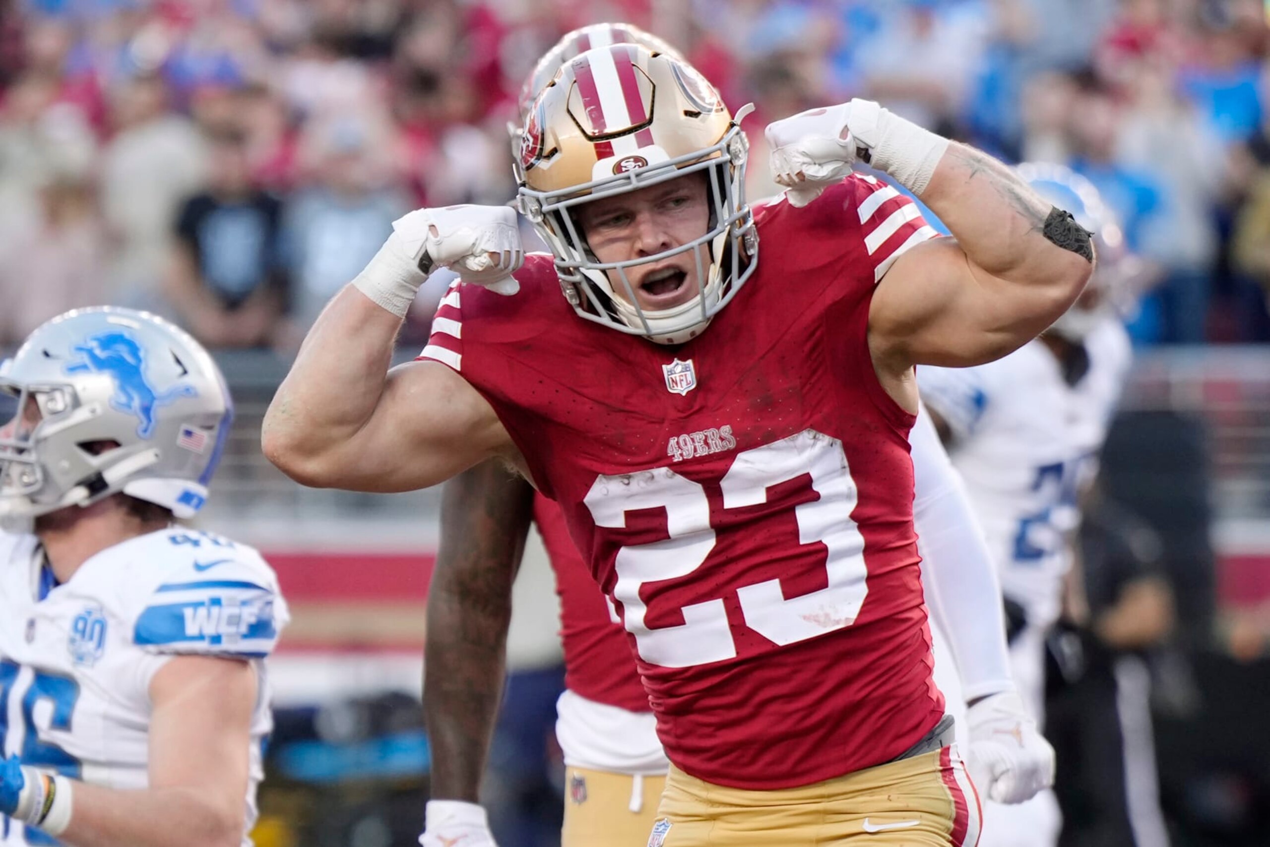 SANTA CLARA, CALIFORNIA - JANUARY 28: Christian McCaffrey #23 of the San Francisco 49ers celebrates after scoring a touchdown during the second quarter against the Detroit Lions in the NFC Championship Game at Levi's Stadium on January 28, 2024 in Santa Clara, California. (Photo by Thearon W. Henderson/Getty Images)