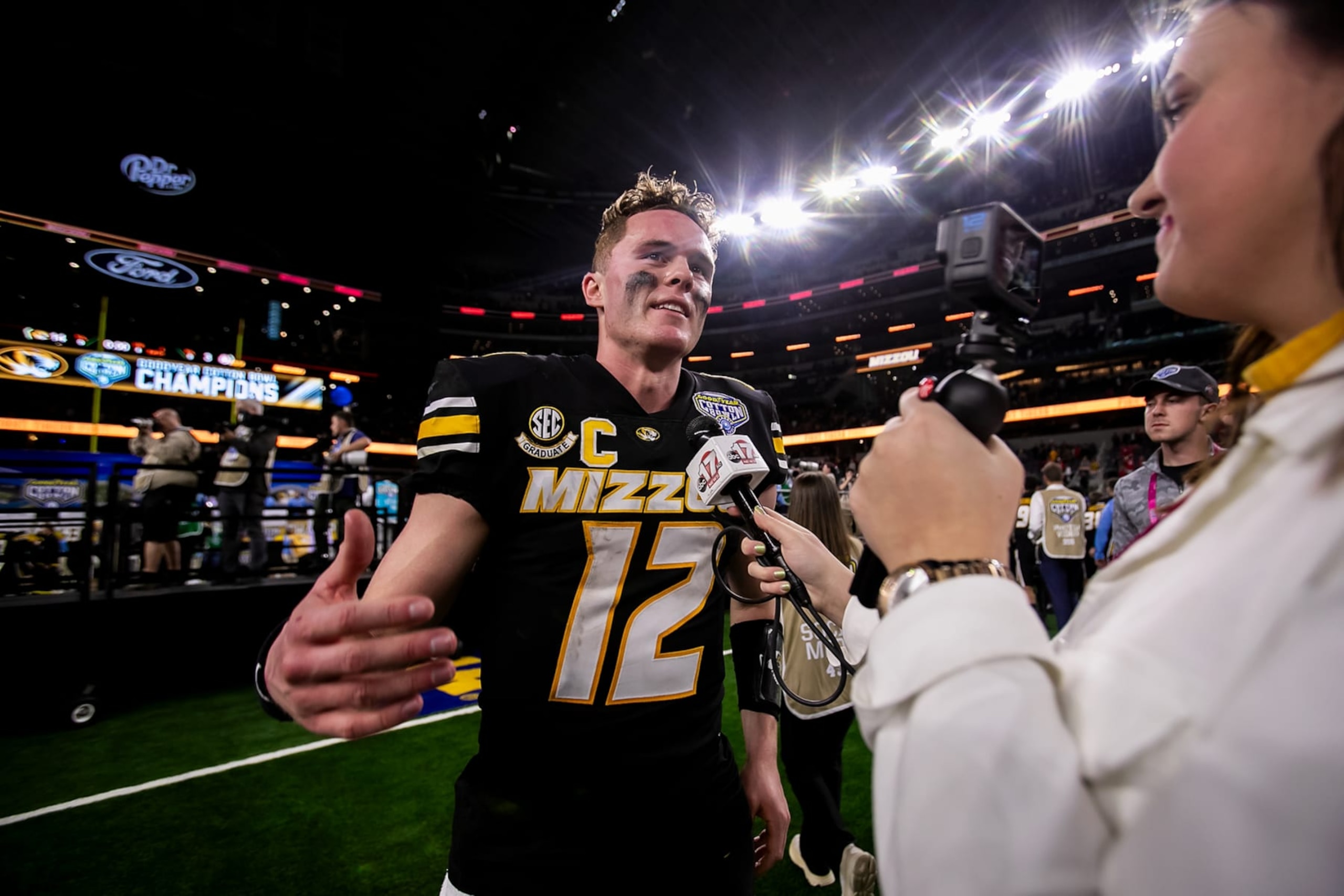 ARLINGTON, TX - DECEMBER 29: Missouri quarterback Brady Cook (12) reacts during an interview during the 88th annual Cotton Bowl game between the Missouri Tigers and the Ohio State Buckeyes on Friday, December 29, 2023 at AT&T Stadium in Arlington, TX.  (Photo by Nick Tre. Smith/Icon Sportswire via Getty Images)