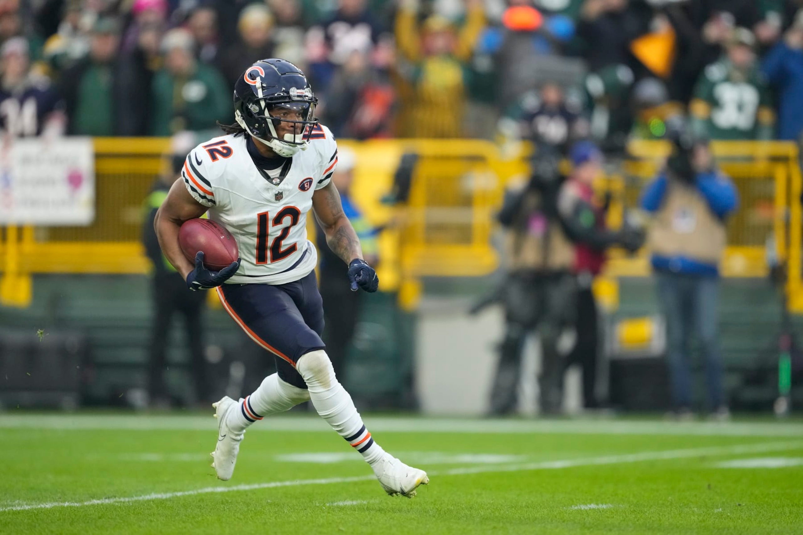 GREEN BAY, WISCONSIN - JANUARY 07: Velus Jones Jr. #12 of the Chicago Bears runs with the ball in the first half against the Green Bay Packers at Lambeau Field on January 07, 2024 in Green Bay, Wisconsin. (Photo by Patrick McDermott/Getty Images)