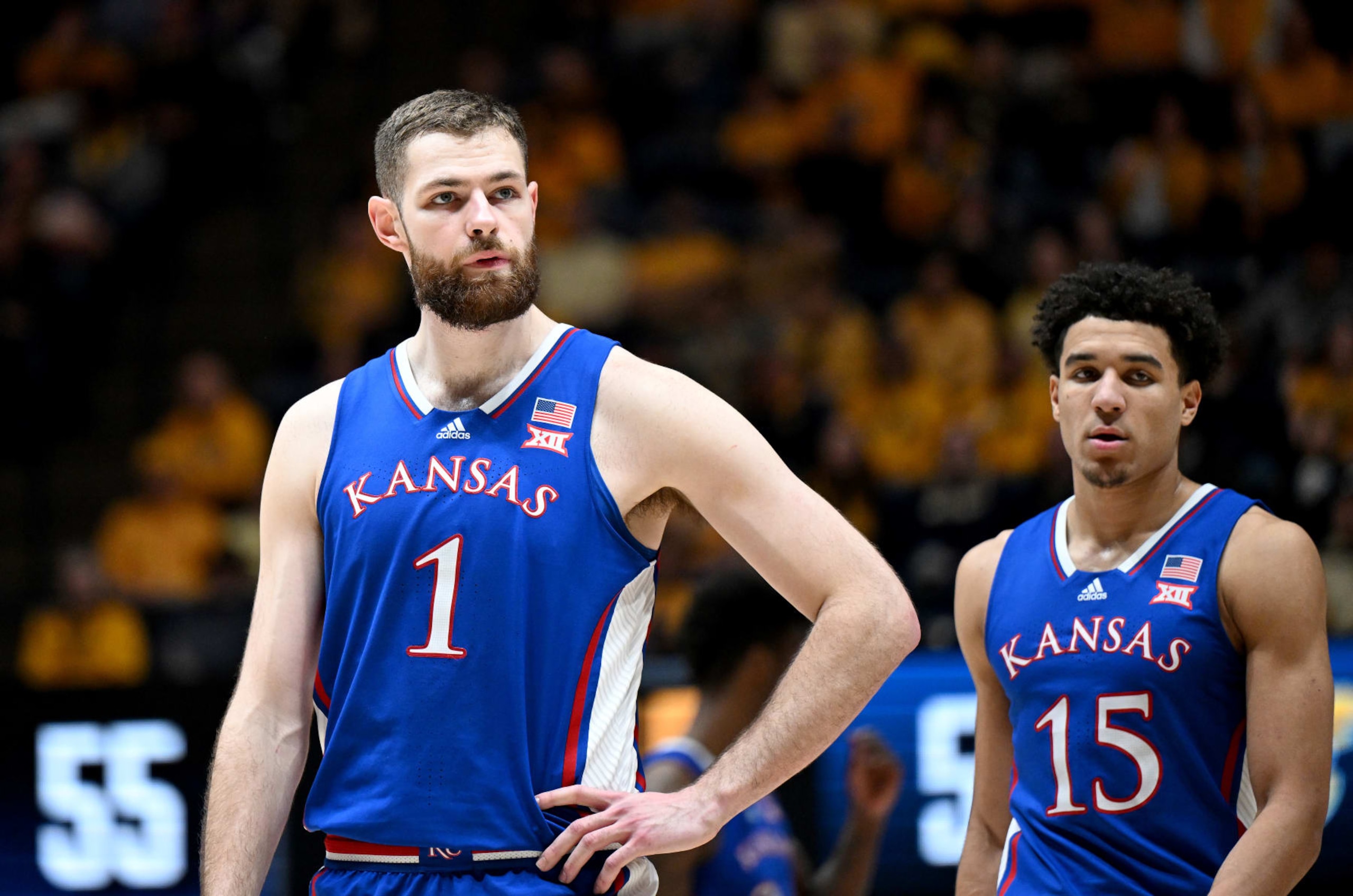MORGANTOWN, WEST VIRGINIA - JANUARY 20: Hunter Dickinson #1 and Kevin McCullar Jr. #15 of the Kansas Jayhawks walk down the court during the game against the West Virginia Mountaineers at WVU Coliseum on January 20, 2024 in Morgantown, West Virginia. (Photo by G Fiume/Getty Images)