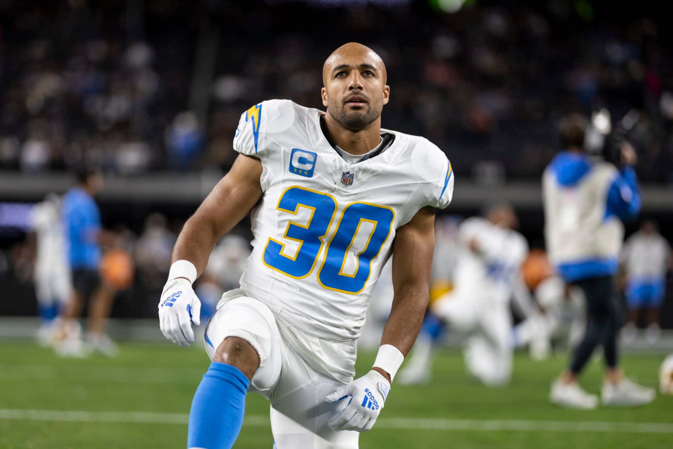 LAS VEGAS, NEVADA - DECEMBER 14: Austin Ekeler #30 of the Los Angeles Chargers stretches as he warms up prior to an NFL football game between the Las Vegas Raiders and the Los Angeles Chargers at Allegiant Stadium on December 14, 2023 in Las Vegas, Nevada. (Photo by Michael Owens/Getty Images)