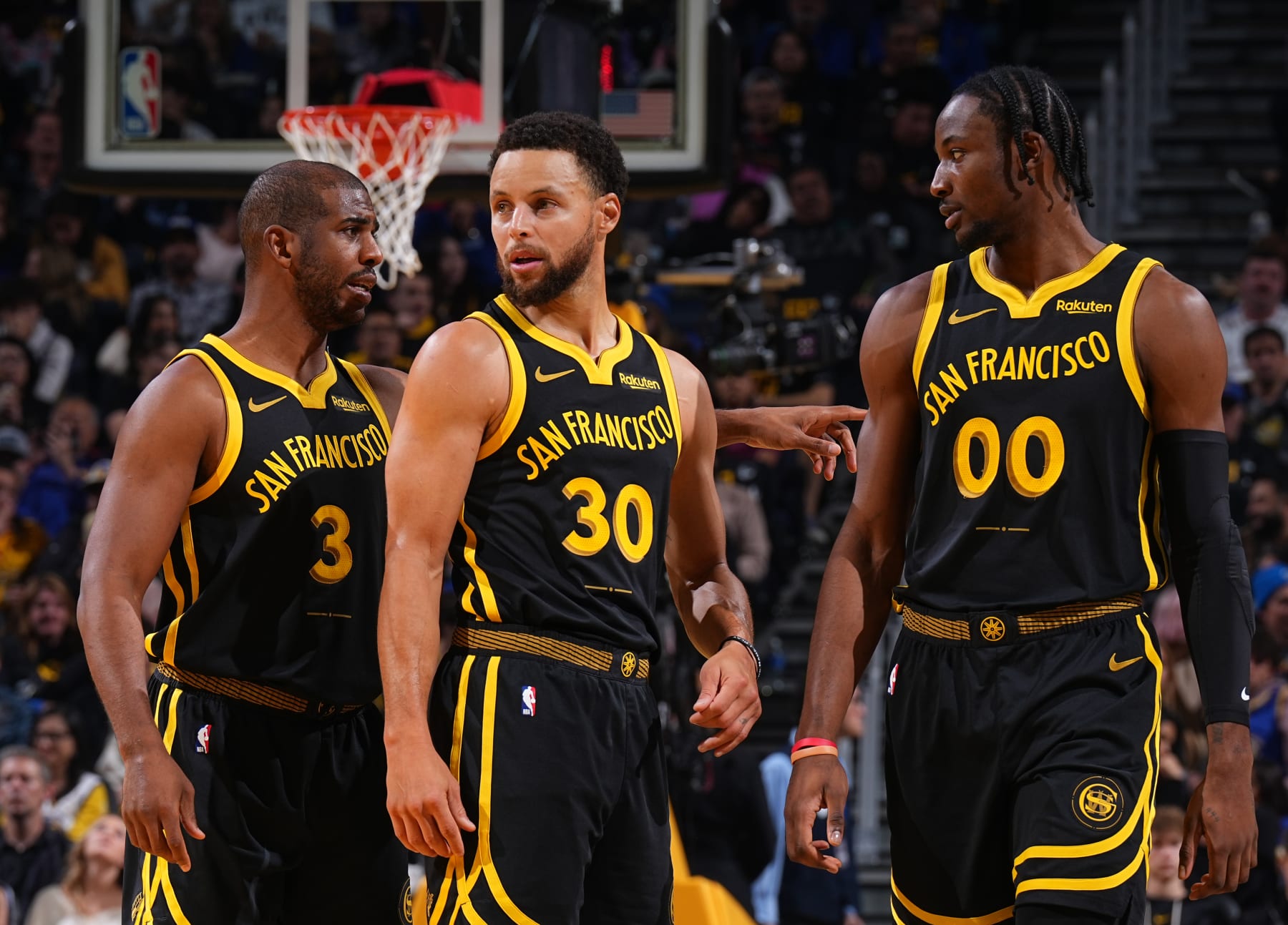 SAN FRANCISCO, CA - NOVEMBER 24: Chris Paul #3, Stephen Curry #30 and Jonathan Kuminga #00 of the Golden State Warriors looks on during the In-Season Tournament against the San Antonio Spurs on November 24, 2023 at Chase Center in San Francisco, California. NOTE TO USER: User expressly acknowledges and agrees that, by downloading and or using this photograph, user is consenting to the terms and conditions of Getty Images License Agreement. Mandatory Copyright Notice: Copyright 2023 NBAE (Photo by Garrett Ellwood/NBAE via Getty Images)