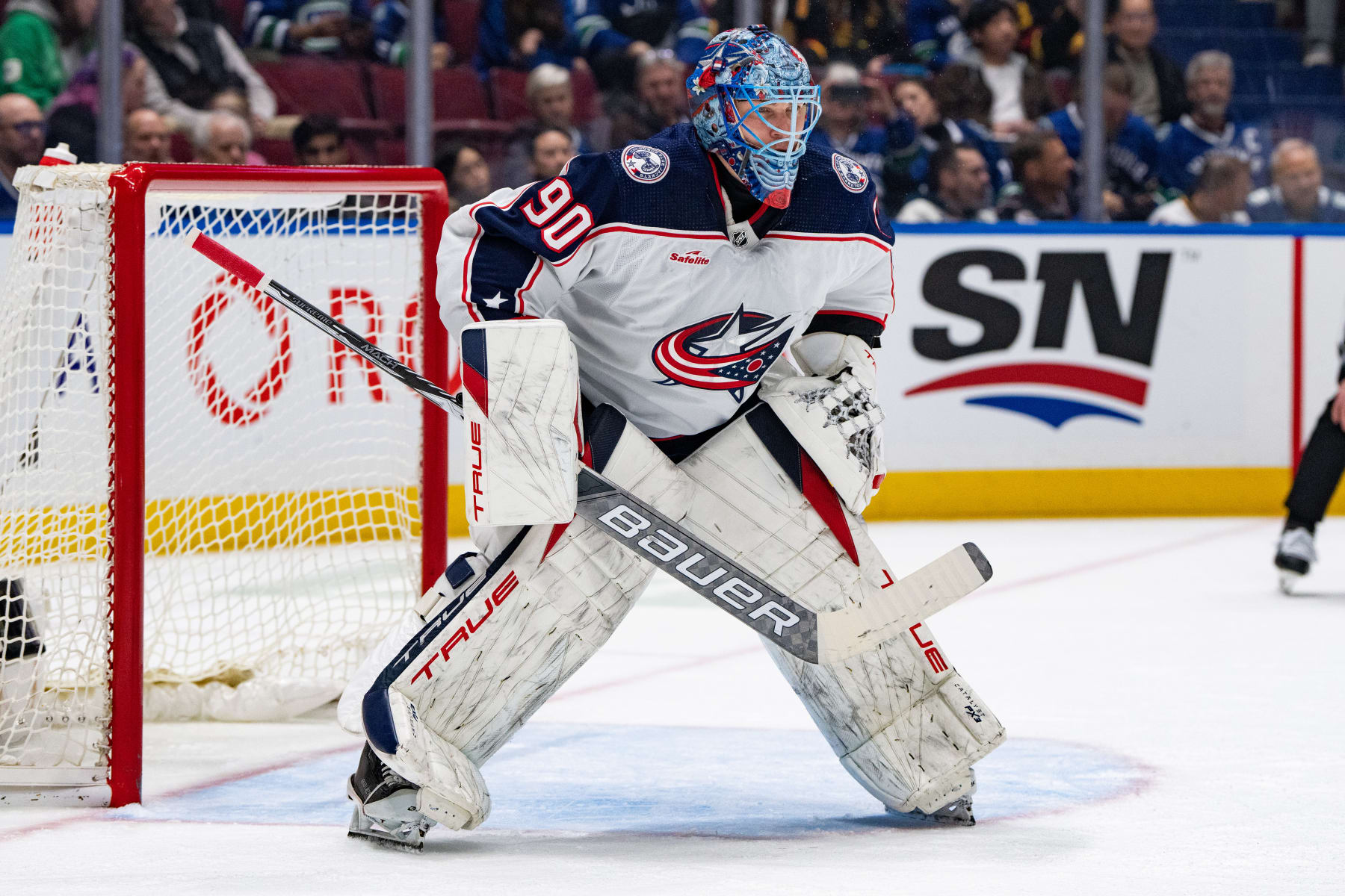 VANCOUVER, BC - JANUARY 27: Columbus Blue Jackets goaltender Elvis Merzlikins (90) waits for a face off during an NHL game between the Columbus Blue Jackets and the Vancouver Canucks on Saturday, January 27, 2024 at Rogers Arena in Vancouver, B.C. (Photo by Ethan Cairns/Icon Sportswire via Getty Images)
