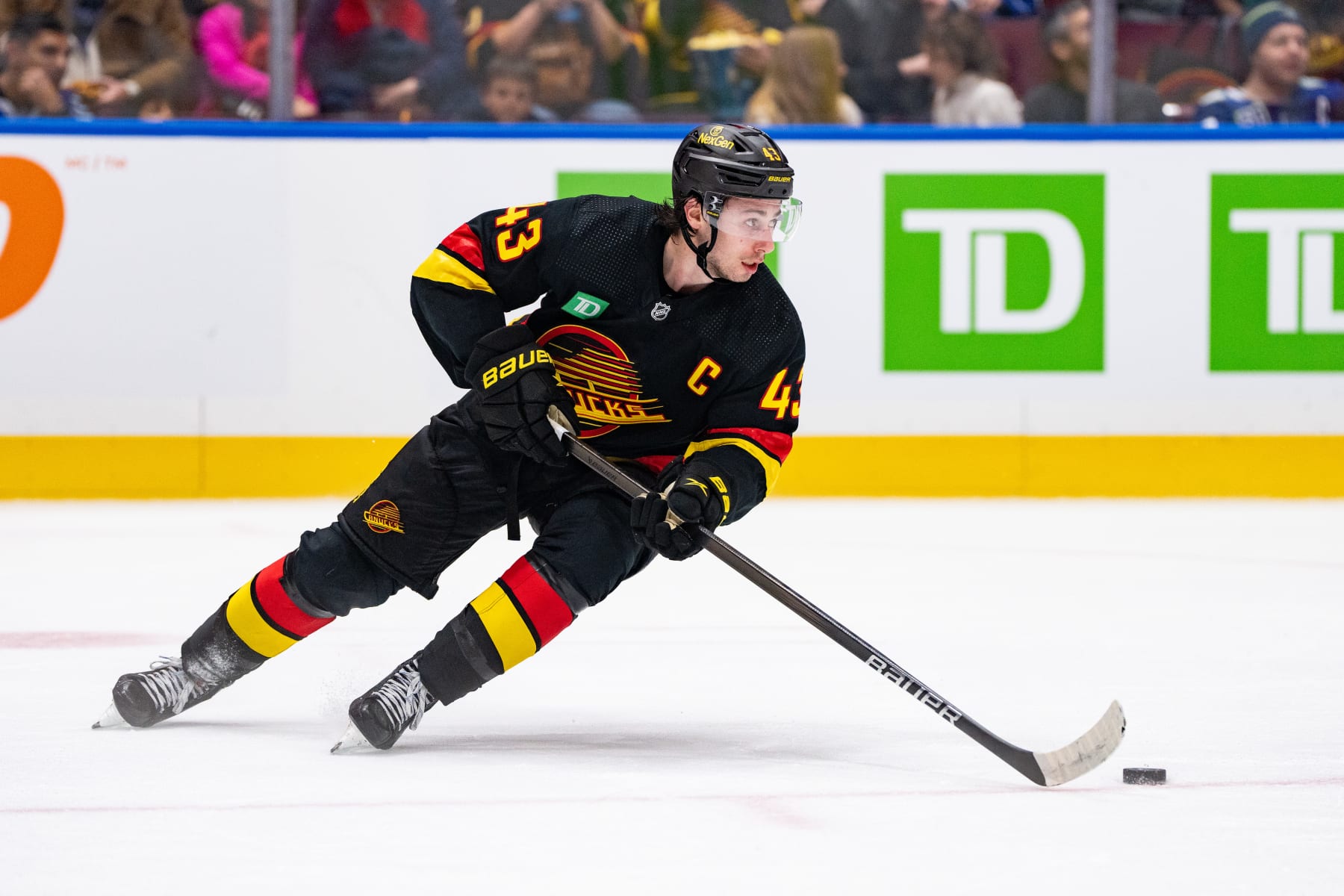 VANCOUVER, BC - JANUARY 27: Vancouver Canucks defenseman Quinn Hughes (43) skates with the puck during an NHL game between the Columbus Blue Jackets and the Vancouver Canucks on Saturday, January 27, 2024 at Rogers Arena in Vancouver, B.C. (Photo by Ethan Cairns/Icon Sportswire via Getty Images)