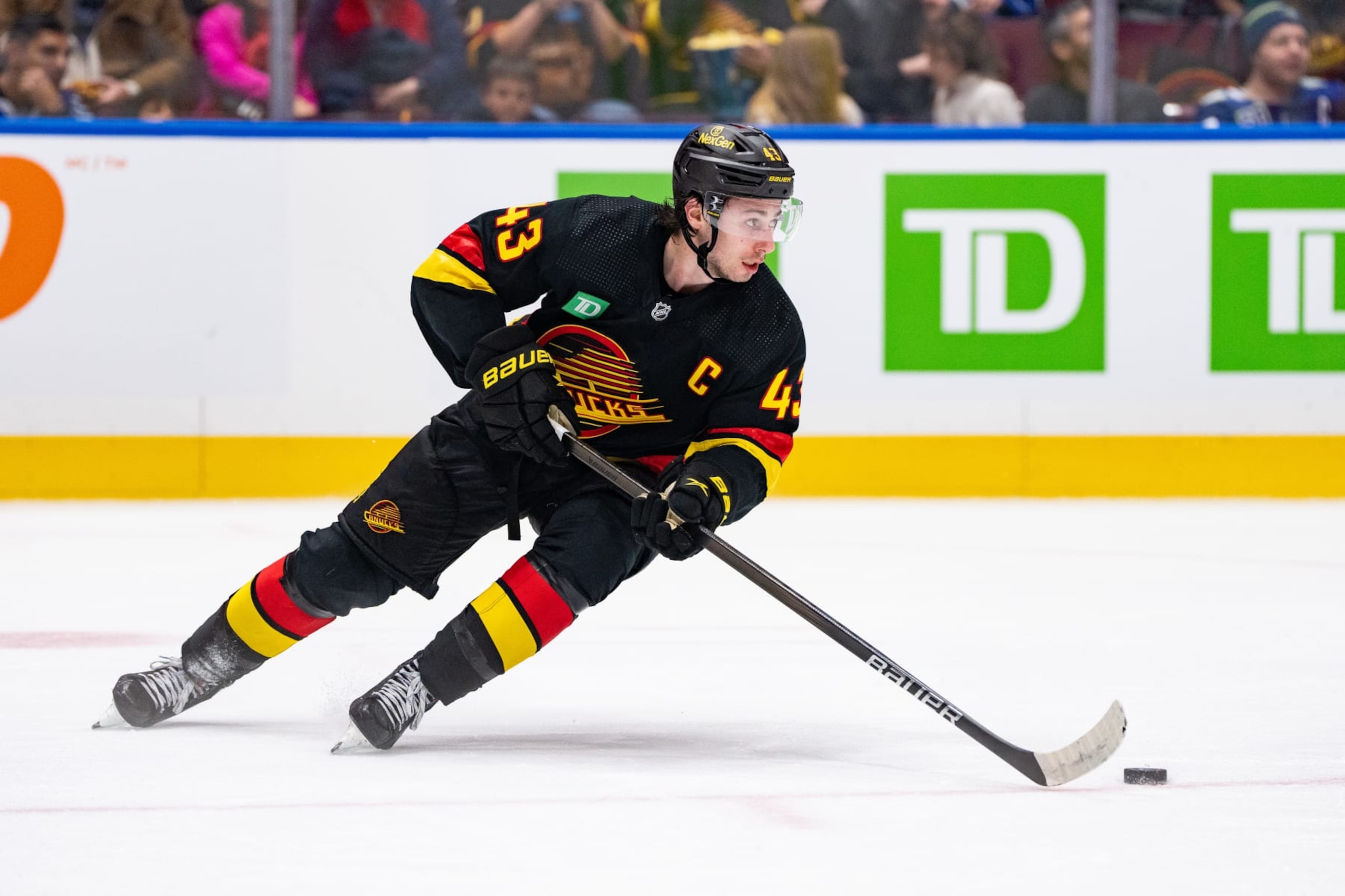 VANCOUVER, BC - JANUARY 27: Vancouver Canucks defenseman Quinn Hughes (43) skates with the puck during an NHL game between the Columbus Blue Jackets and the Vancouver Canucks on Saturday, January 27, 2024 at Rogers Arena in Vancouver, B.C. (Photo by Ethan Cairns/Icon Sportswire via Getty Images)