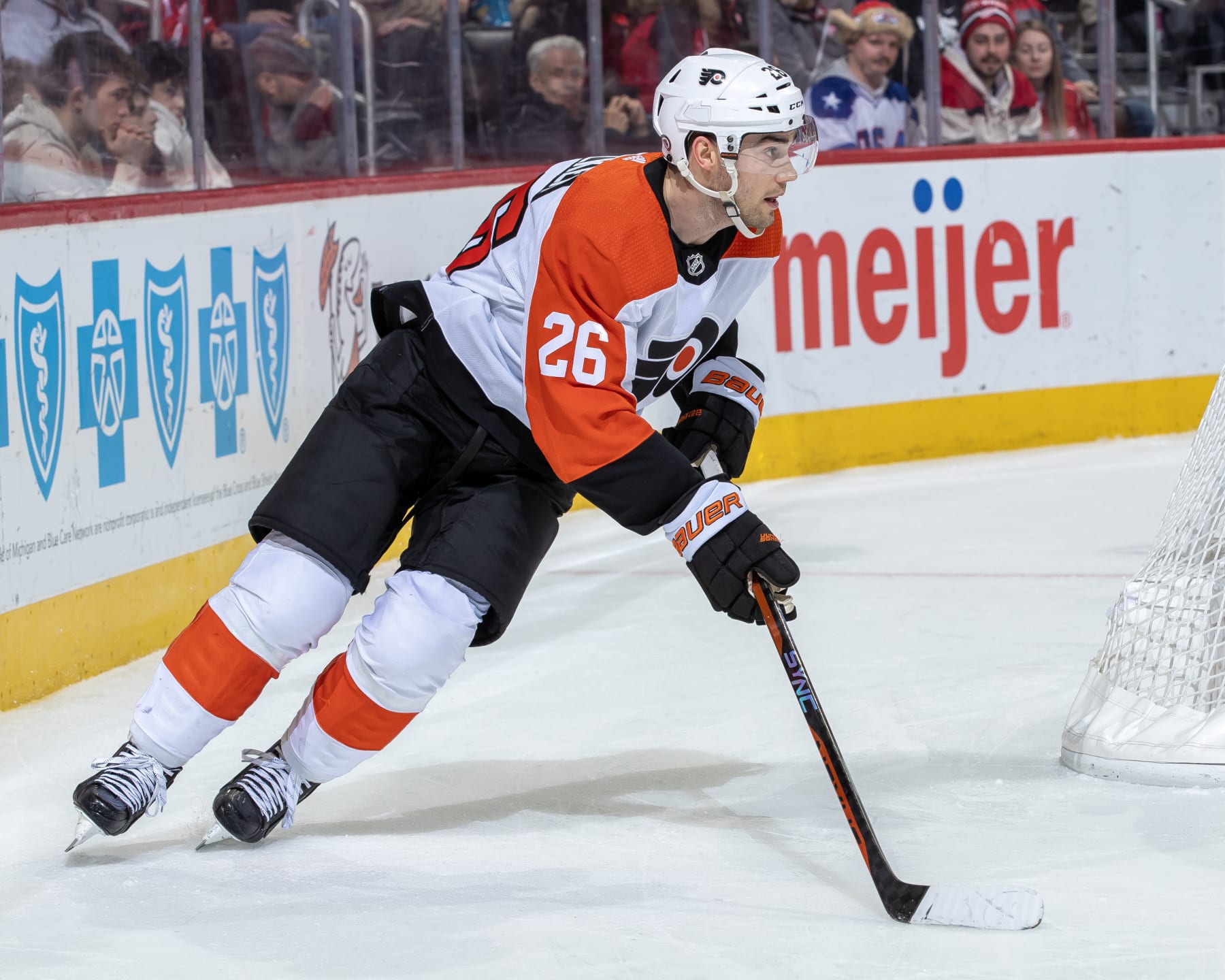 DETROIT, MI - JANUARY 25: Sean Walker #26 of the Philadelphia Flyers skates around the net with the puck against the Detroit Red Wings during the third period at Little Caesars Arena on January 25, 2024 in Detroit, Michigan. Detroit defeated Philadelphia 3-0. (Photo by Dave Reginek/NHLI via Getty Images)