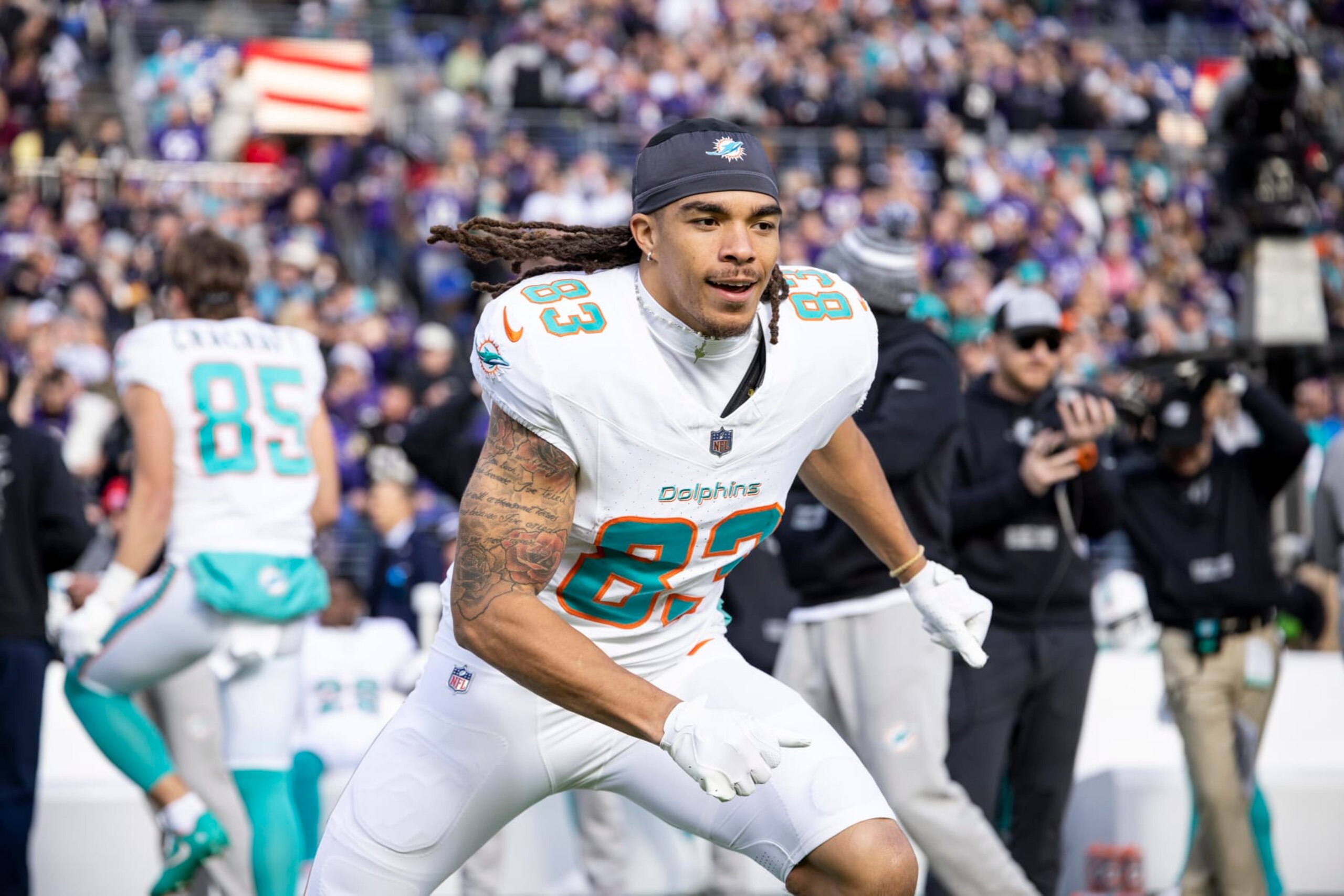 BALTIMORE, MARYLAND - DECEMBER 31: Chase Claypool #83 of the Miami Dolphins reacts as he runs prior to an NFL football game between the Baltimore Ravens and the Miami Dolphins at M&T Bank Stadium on December 31, 2023 in Baltimore, Maryland. (Photo by Michael Owens/Getty Images)