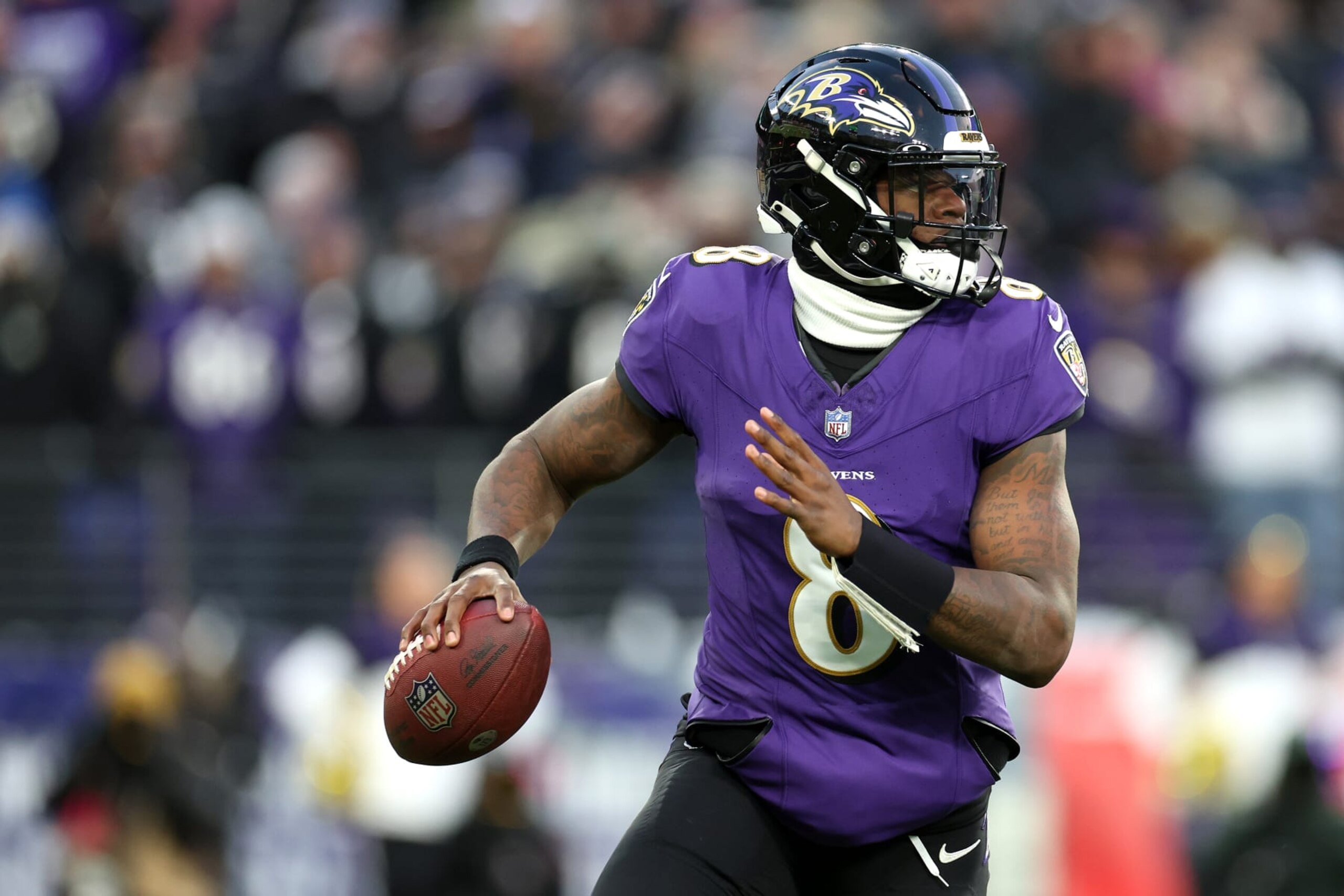 BALTIMORE, MARYLAND - JANUARY 20: Quarterback Lamar Jackson #8 of the Baltimore Ravens looks to pass against the Houston Texans during the AFC Divisional Playoff game at M&T Bank Stadium on January 20, 2024 in Baltimore, Maryland. (Photo by Rob Carr/Getty Images)
