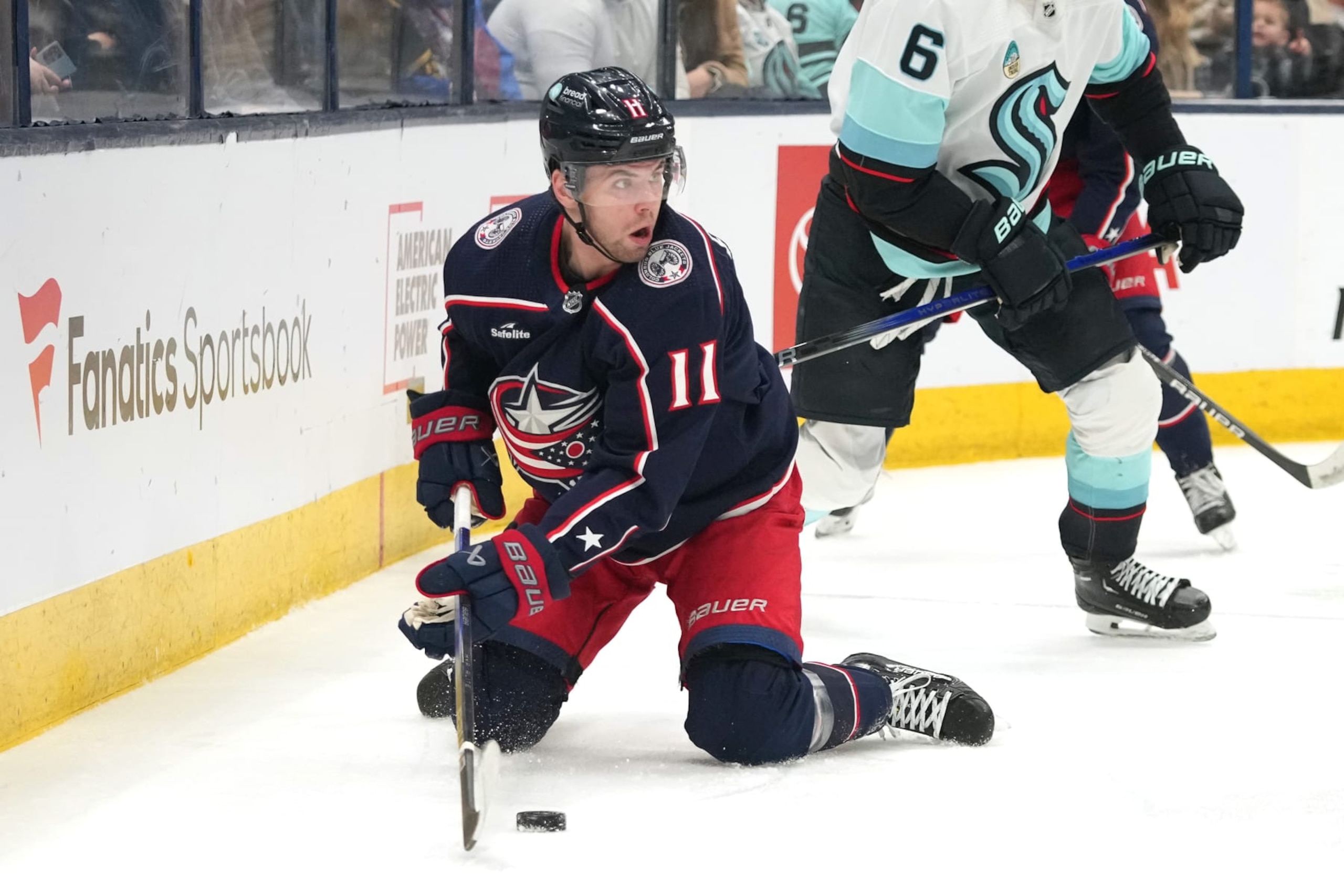 COLUMBUS, OHIO - JANUARY 13: Adam Fantilli #11 of the Columbus Blue Jackets plays the puck from his knees during the second period against the Seattle Kraken at Nationwide Arena on January 13, 2024 in Columbus, Ohio. (Photo by Jason Mowry/Getty Images)