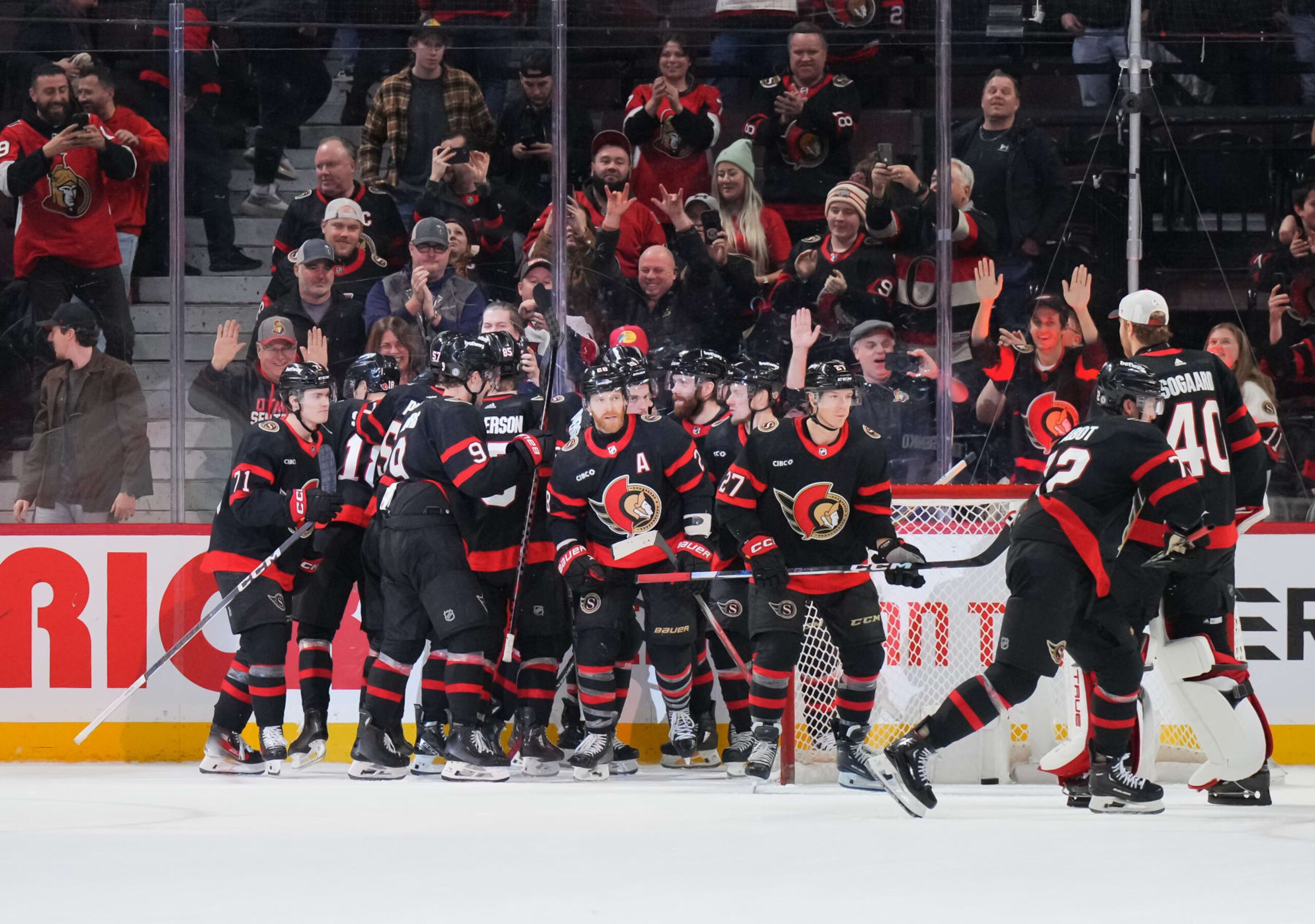 OTTAWA, CANADA - JANUARY 29: Claude Giroux #28 of the Ottawa Senators celebrates his game winning overtime goal against the Nashville Predators with teammates at Canadian Tire Centre on January 29, 2024 in Ottawa, Ontario, Canada.  (Photo by André Ringuette/NHLI via Getty Images)