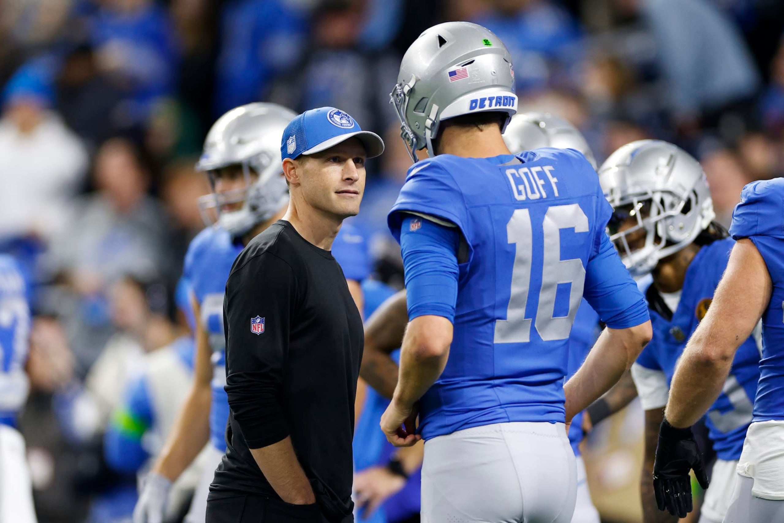 DETROIT, MICHIGAN - NOVEMBER 23: Offensive coordinator Ben Johnson and Jared Goff #16 of the Detroit Lions speak on the field prior to a game against the Green Bay Packers at Ford Field on November 23, 2023 in Detroit, Michigan. (Photo by Mike Mulholland/Getty Images)