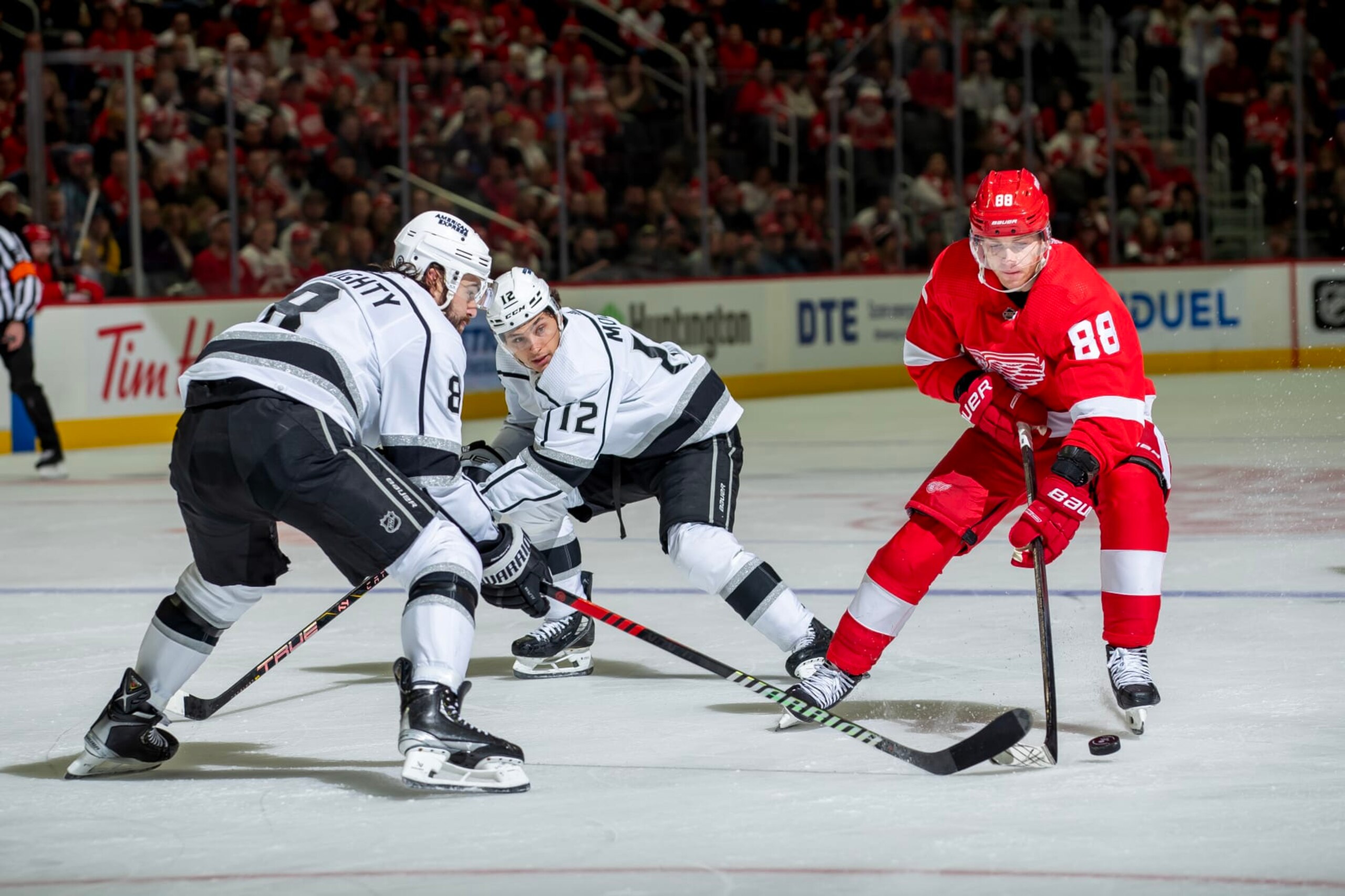 DETROIT, MI - JANUARY 13: Drew Doughty #8 of the Los Angeles Kings defends against Patrick Kane #88 of the Detroit Red Wings during first period at Little Caesars Arena. (Photo by Dave Reginek/NHLI via Getty Images)