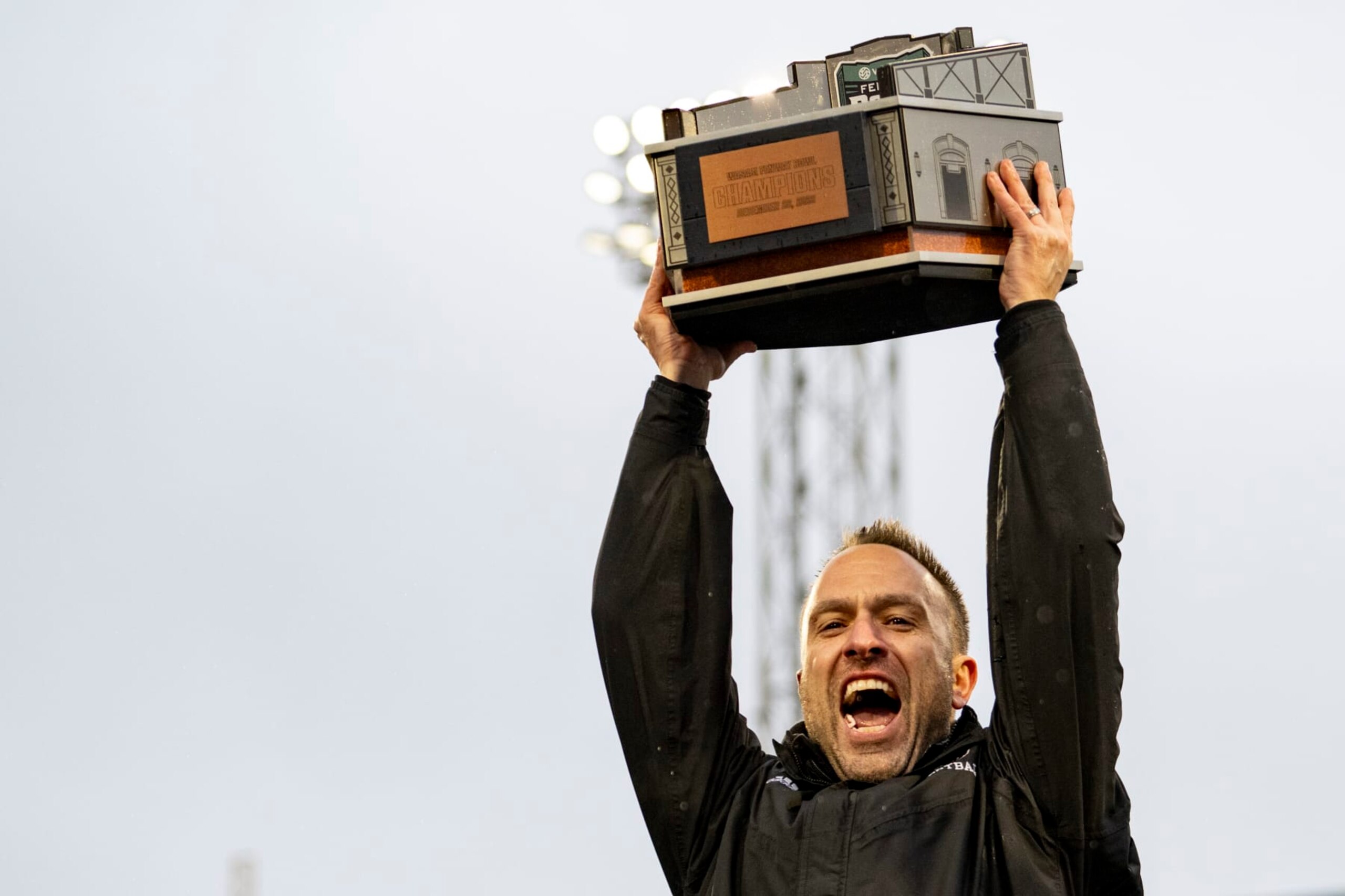 BOSTON, MA - DECEMBER 28: Head coach Jeff Hafley of the Boston College Eagles reacts as he lifts the trophy after a victory during the 2023 Wasabi Fenway Bowl against the Southern Methodist University Mustangs on December 28, 2023 at Fenway Park in Boston, Massachusetts. (Photo by Billie Weiss/Boston Red Sox/Getty Images)