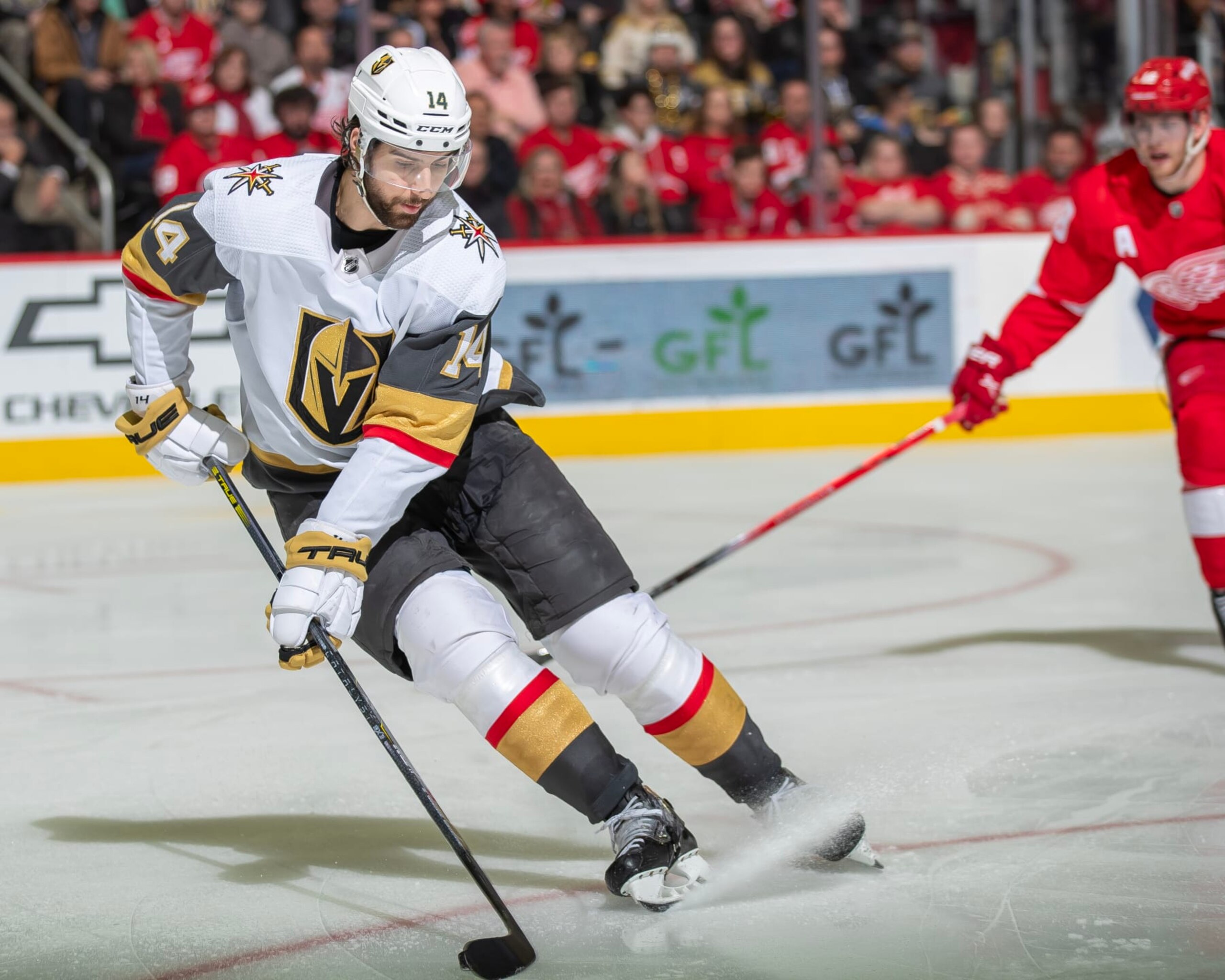 DETROIT, MI - JANUARY 27: Nicolas Hague #14 of the Vegas Golden Knights turns with the puck against the Detroit Red Wings during the third period at Little Caesars Arena on January 27, 2024 in Detroit, Michigan. Detroit defeated Vegas 5-2. (Photo by Dave Reginek/NHLI via Getty Images)