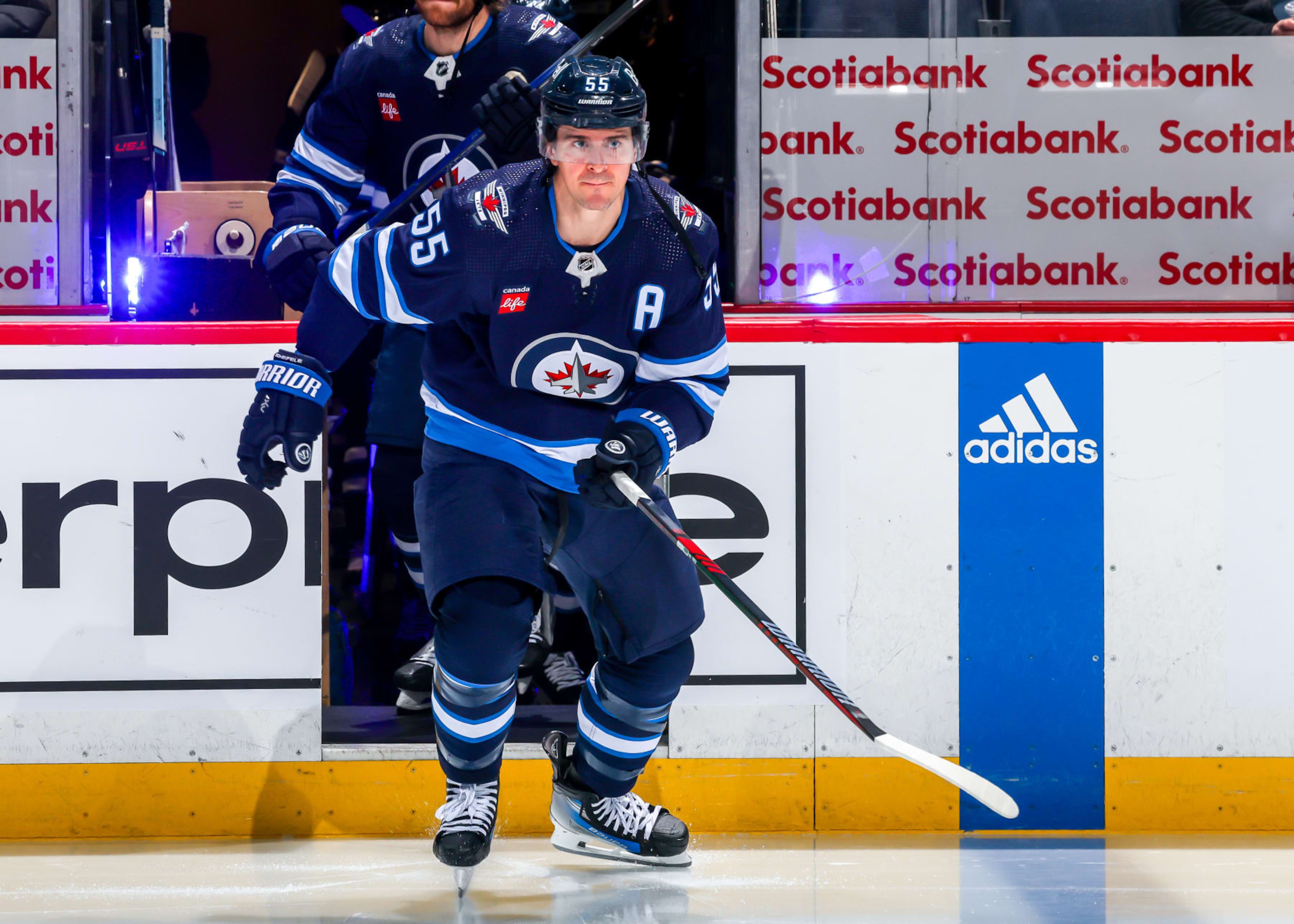 WINNIPEG, CANADA - JANUARY 11: Mark Scheifele #55 of the Winnipeg Jets hits the ice prior to NHL action against the Chicago Blackhawks at Canada Life Centre on January 11, 2024 in Winnipeg, Manitoba, Canada. (Photo by Jonathan Kozub/NHLI via Getty Images)