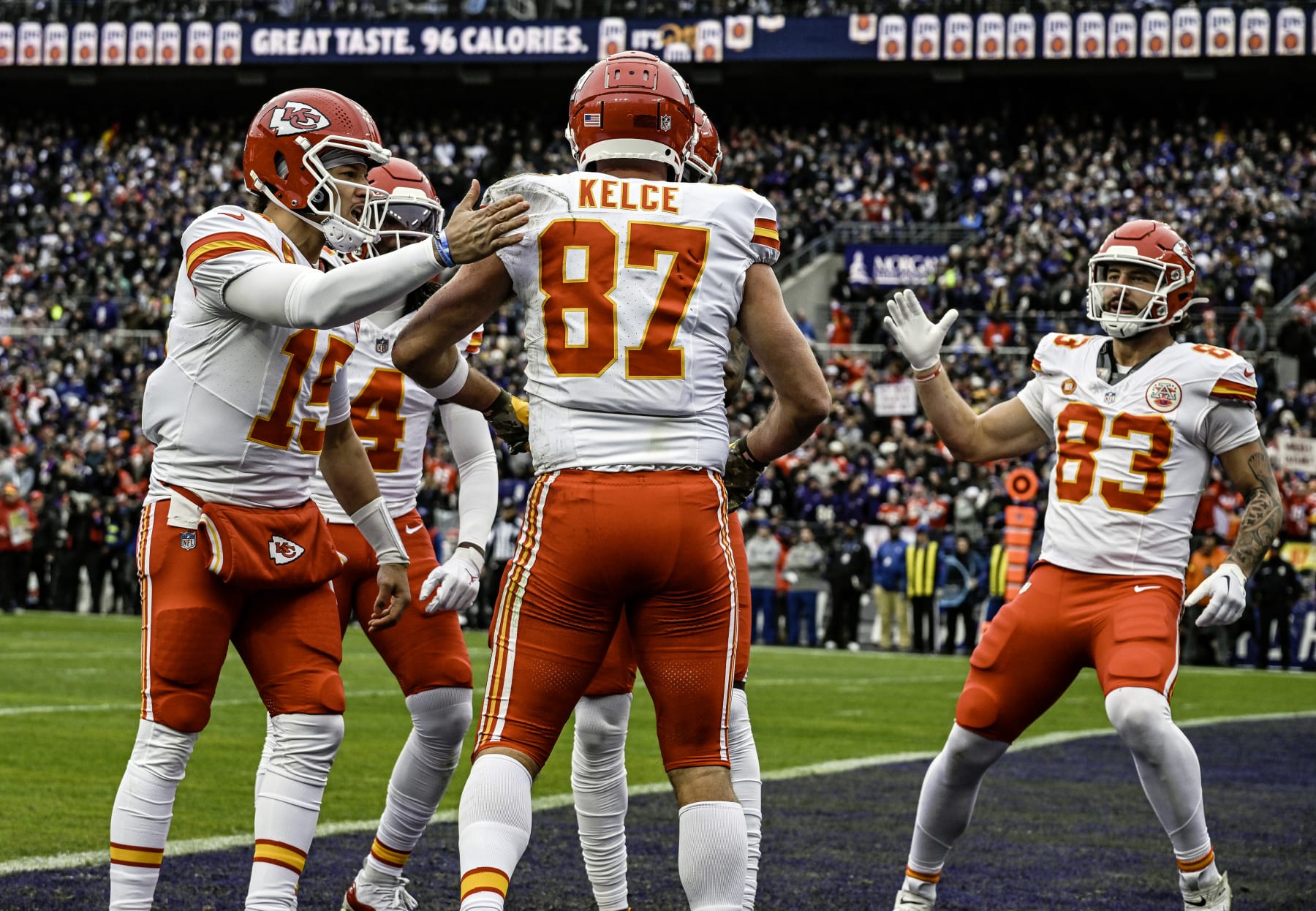 BALTIMORE, MD - JANUARY 28:  Kansas City Chiefs tight end Travis Kelce (87) is congratulated by quarterback Patrick Mahomes (15) and tight end Noah Gray (83) after catching a touchdown pass in the first quarter during the Kansas City Chiefs game versus the Baltimore Ravens in the AFC Championship Game on January 28, 2024 at M&T Bank Stadium in Baltimore, MD.  (Photo by Mark Goldman/Icon Sportswire via Getty Images)