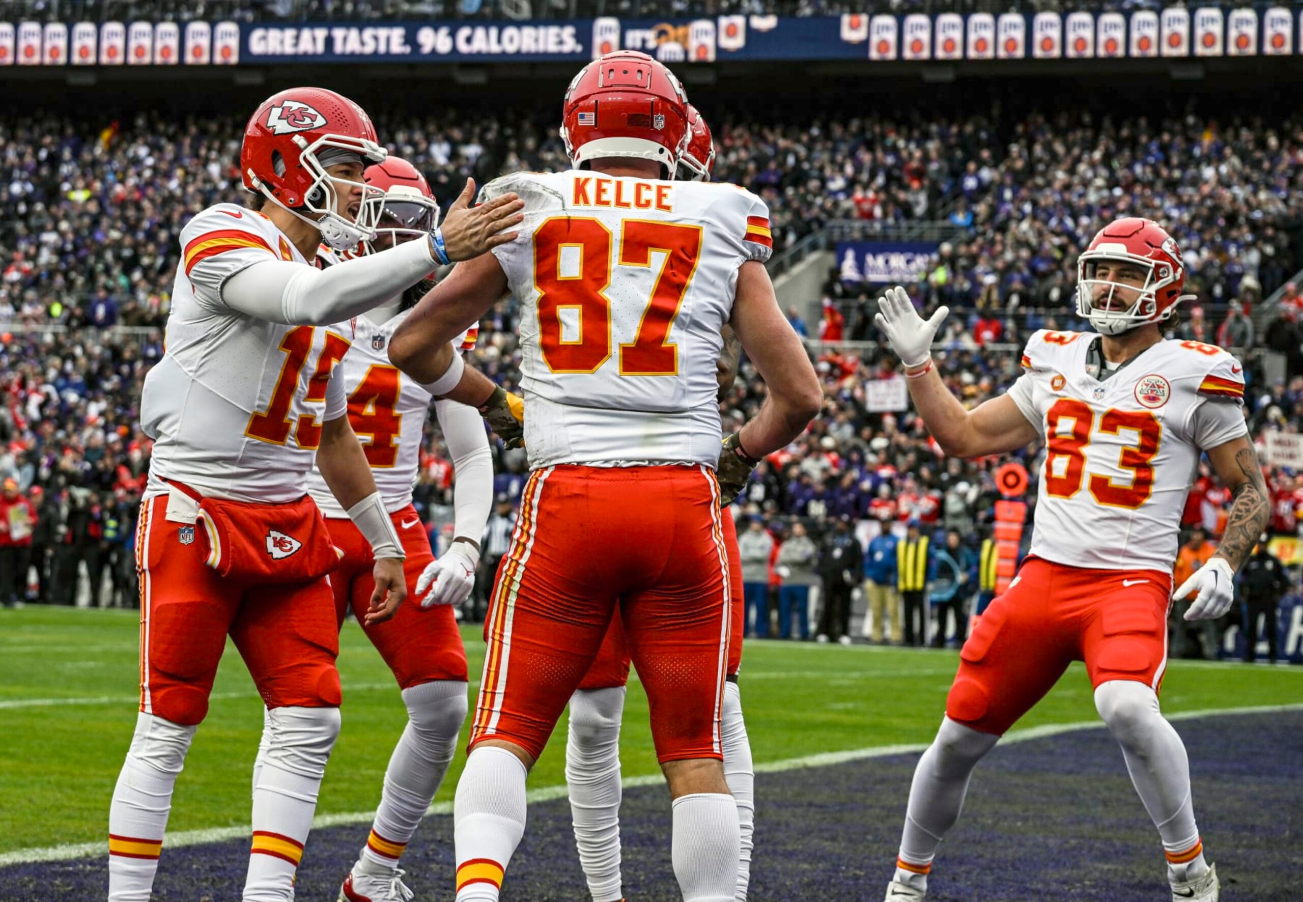 BALTIMORE, MD - JANUARY 28:  Kansas City Chiefs tight end Travis Kelce (87) is congratulated by quarterback Patrick Mahomes (15) and tight end Noah Gray (83) after catching a touchdown pass in the first quarter during the Kansas City Chiefs game versus the Baltimore Ravens in the AFC Championship Game on January 28, 2024 at M&T Bank Stadium in Baltimore, MD.  (Photo by Mark Goldman/Icon Sportswire via Getty Images)