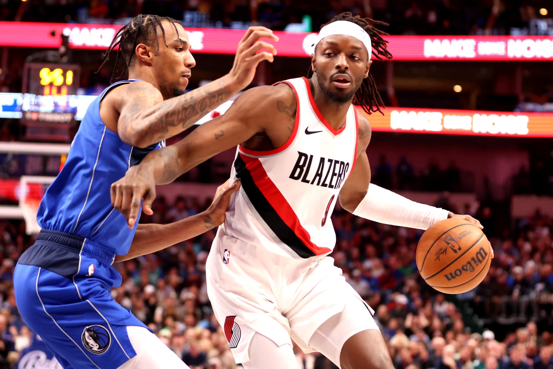 DALLAS, TEXAS - JANUARY 05: Jerami Grant #9 of the Portland Trail Blazers drives to the basket against A.J. Lawson #9 of the Dallas Mavericks in the first half at American Airlines Center on January 05, 2024 in Dallas, Texas. NOTE TO USER: User expressly acknowledges and agrees that, by downloading and or using this photograph, User is consenting to the terms and conditions of the Getty Images License Agreement. (Photo by Tim Heitman/Getty Images)