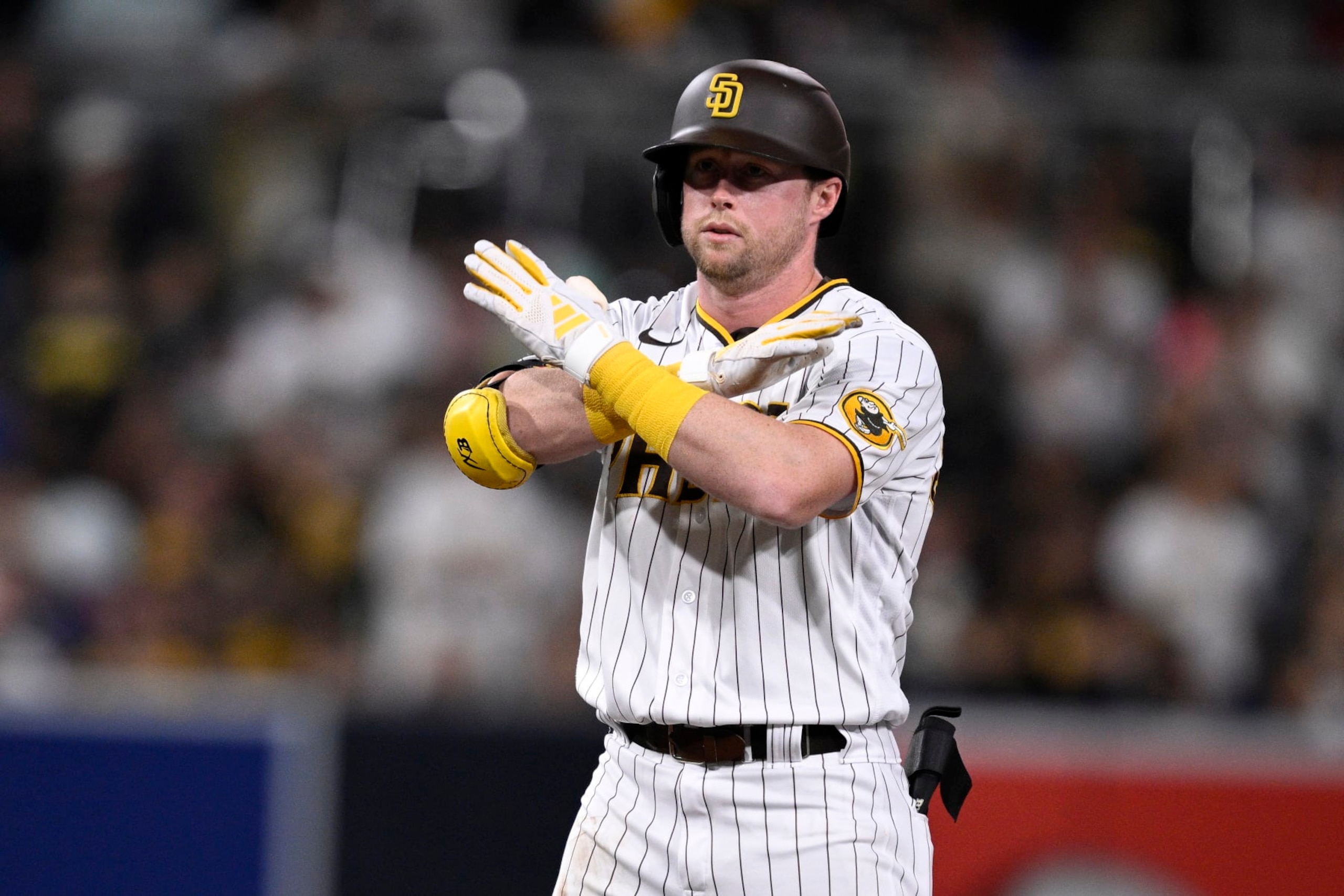 SAN DIEGO, CALIFORNIA - AUGUST 17: Jake Cronenworth #9 of the San Diego Padres gestures after hitting a double against the Arizona Diamondbacks during the fifth inning at PETCO Park on August 17, 2023 in San Diego, California. (Photo by Orlando Ramirez/Getty Images) SAN DIEGO, CALIFORNIA - AUGUST 17: Jake Cronenworth #9 of the San Diego Padres gestures after hitting a double against the Arizona Diamondbacks during the fifth inning at PETCO Park on August 17, 2023 in San Diego, California. (Photo by Orlando Ramirez/Getty Images)