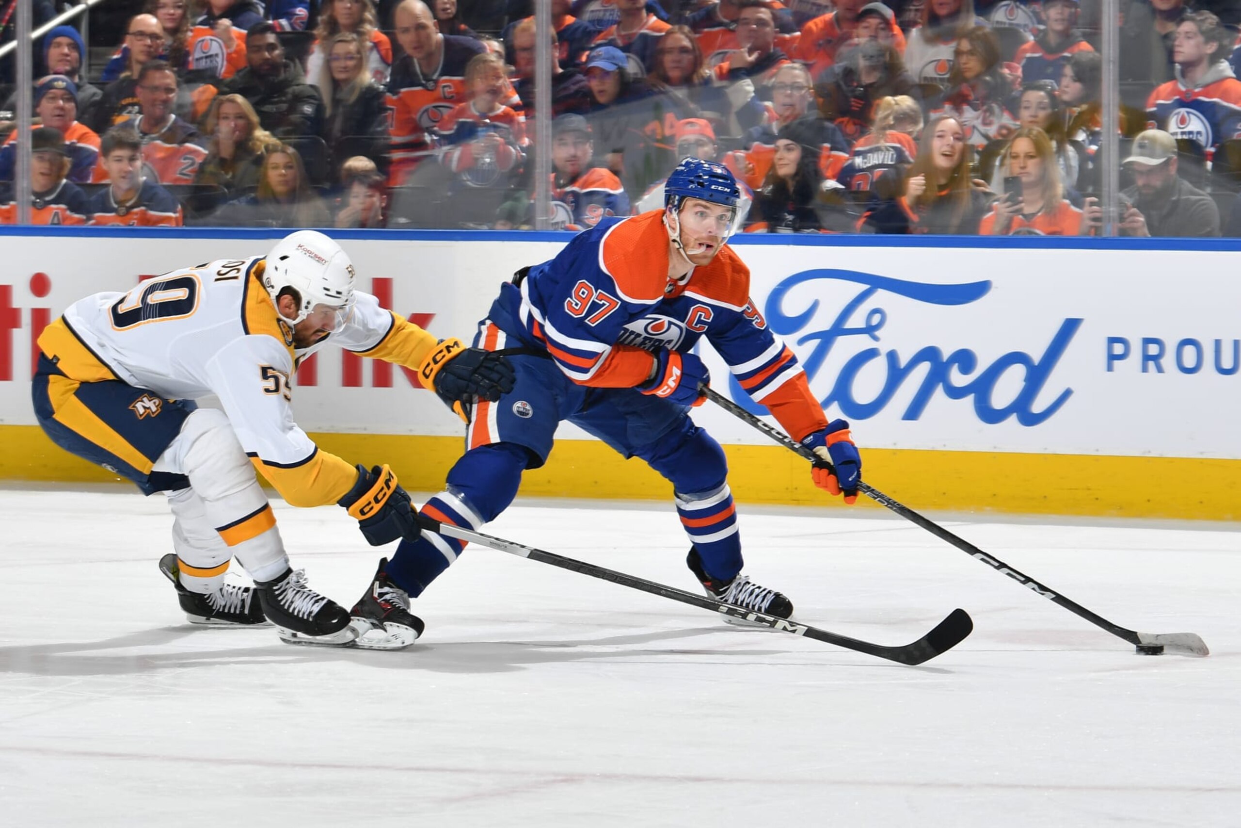 EDMONTON, CANADA - JANUARY 27: Connor McDavid #97 of the Edmonton Oilers skates during the game against Roman Josi #59 of the Nashville Predators at Rogers Place on January 27, 2024, in Edmonton, Alberta, Canada. (Photo by Andy Devlin/NHLI via Getty Images)