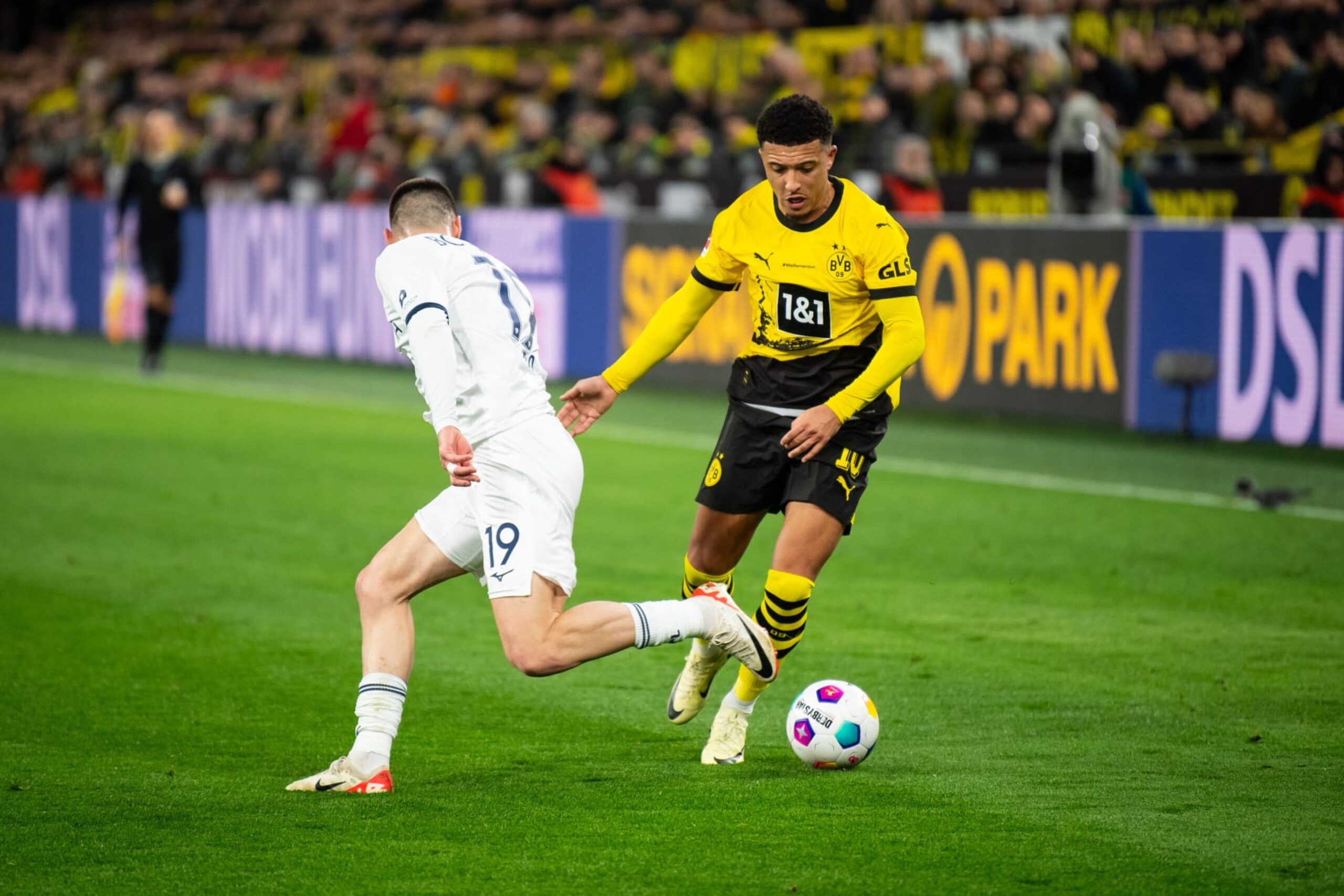 DORTMUND, GERMANY - JANUARY 28: Matus Bero (L) of Bochum battles for possession with Jadon Sancho (R) of Dortmund during the Bundesliga football match between Borussia Dortmund and VfL Bochum at Signal Iduna Park on January 28, 2024 in Dortmund, Germany. (Photo by Hesham Elsherif/Anadolu via Getty Images)