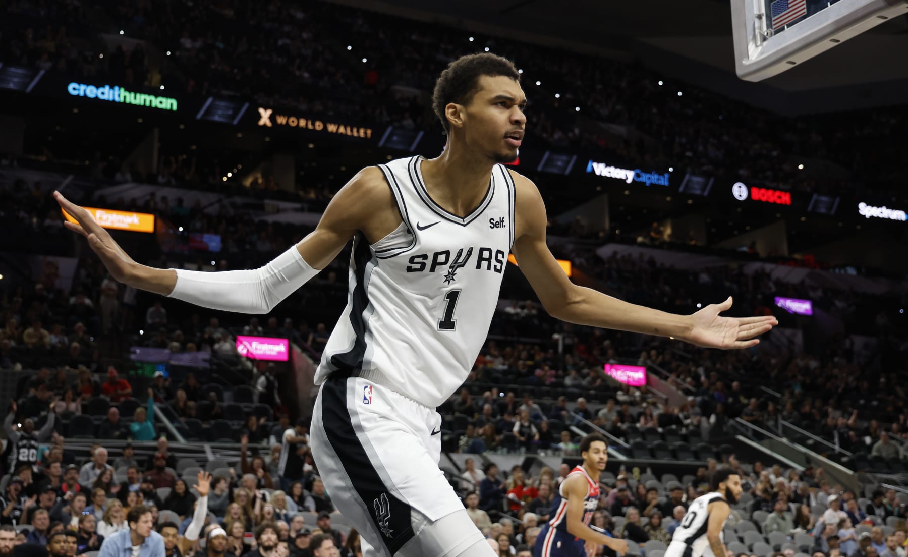 SAN ANTONIO, TX - JANUARY  29: Victor Wembanyama #1 of the San Antonio Spurs reacts to an official during the game against the Washington Wizards in the first half at Frost Bank Center on January 29, 2024 in San Antonio, Texas. NOTE TO USER: User expressly acknowledges and agrees that, by downloading and or using this photograph, User is consenting to terms and conditions of the Getty Images License Agreement. (Photo by Ronald Cortes/Getty Images)