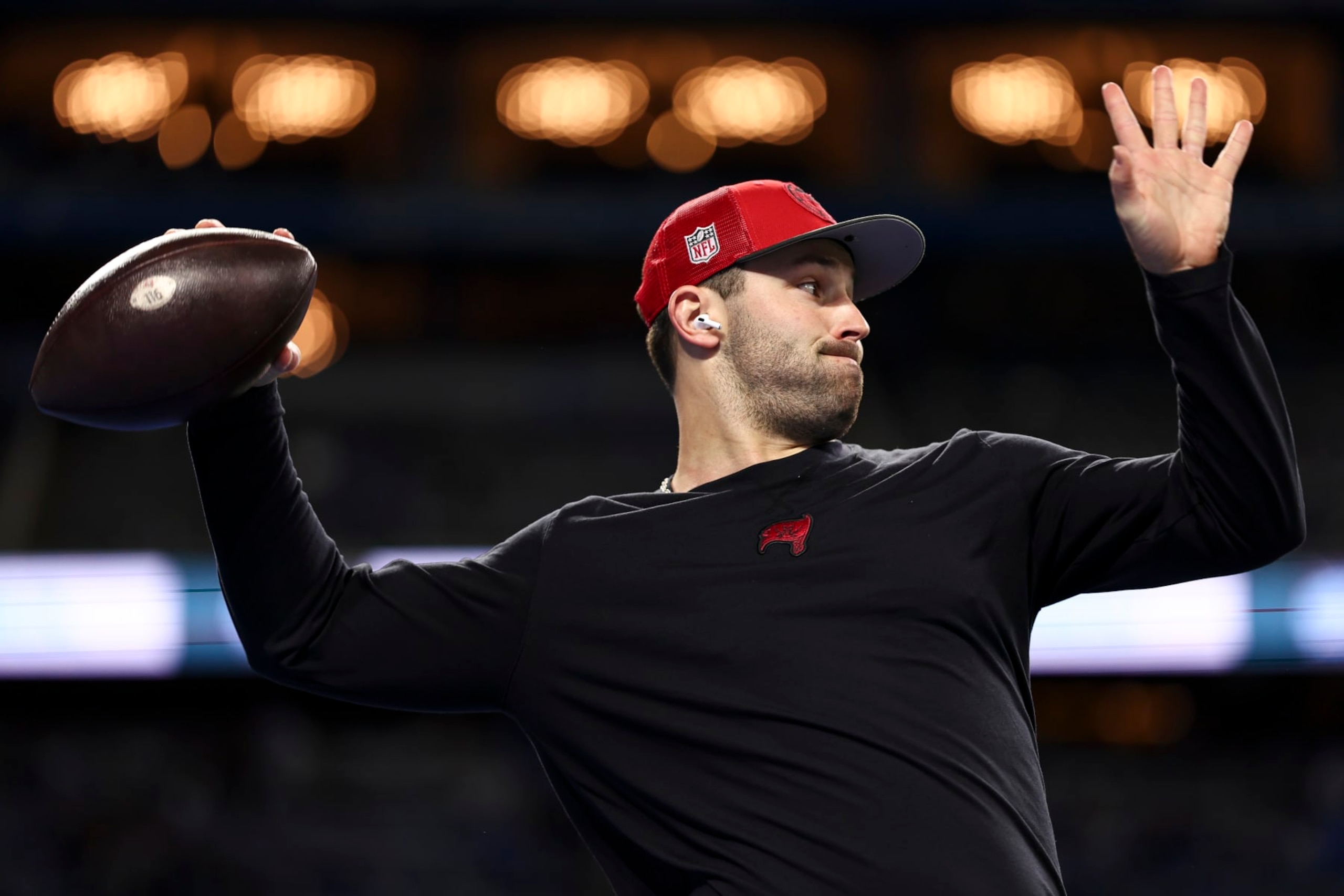 DETROIT, MI - JANUARY 21: Baker Mayfield #6 of the Tampa Bay Buccaneers warms up wearing Apple AirPods prior to an NFL divisional round playoff football game against the Detroit Lions at Ford Field on January 21, 2024 in Detroit, Michigan. (Photo by Kevin Sabitus/Getty Images)