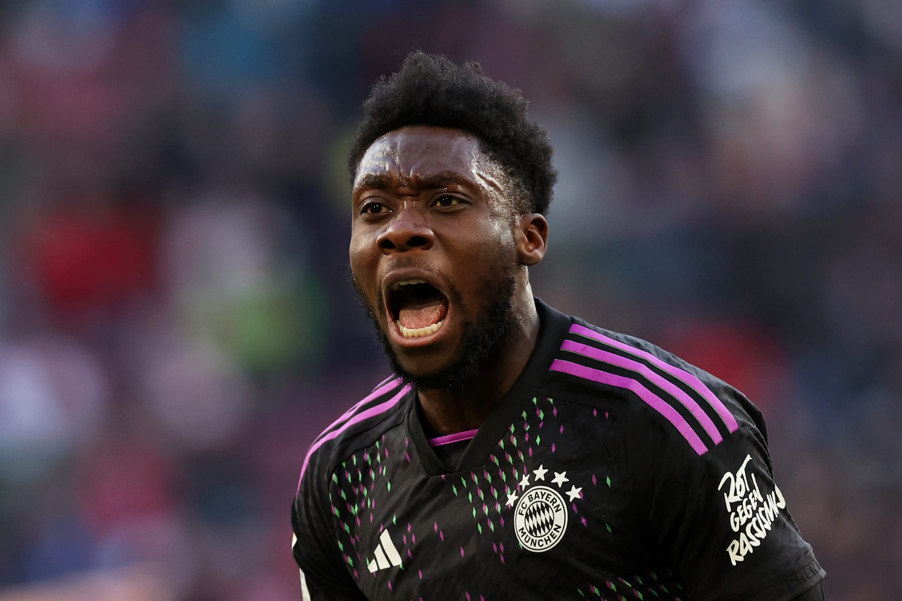AUGSBURG, GERMANY - JANUARY 27: Alphonso Davies of Bayern Munich celebrates scoring his team's second goal during the Bundesliga match between FC Augsburg and FC Bayern München at WWK-Arena on January 27, 2024 in Augsburg, Germany. (Photo by Alexander Hassenstein/Getty Images)