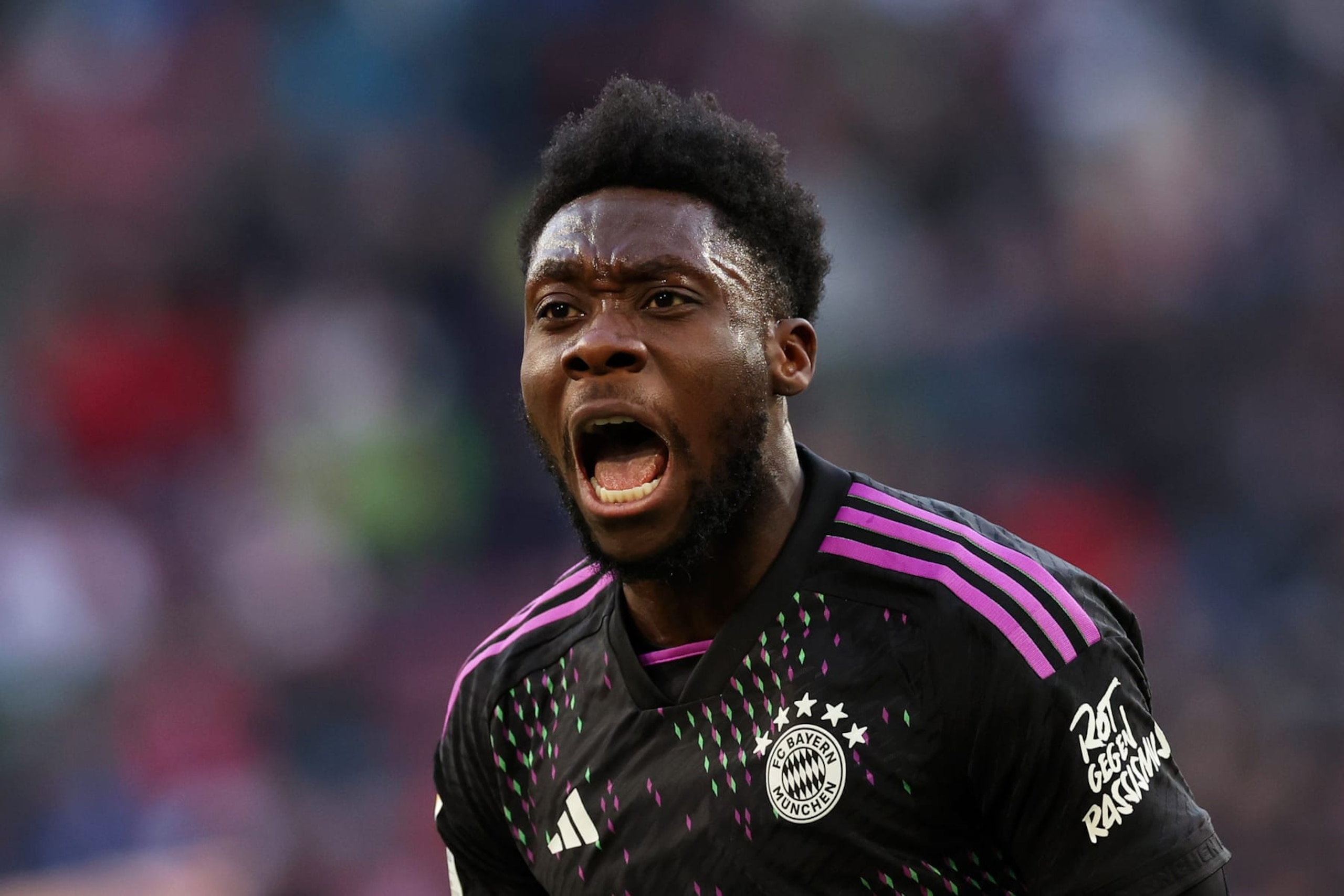 AUGSBURG, GERMANY - JANUARY 27: Alphonso Davies of Bayern Munich celebrates scoring his team's second goal during the Bundesliga match between FC Augsburg and FC Bayern München at WWK-Arena on January 27, 2024 in Augsburg, Germany. (Photo by Alexander Hassenstein/Getty Images)