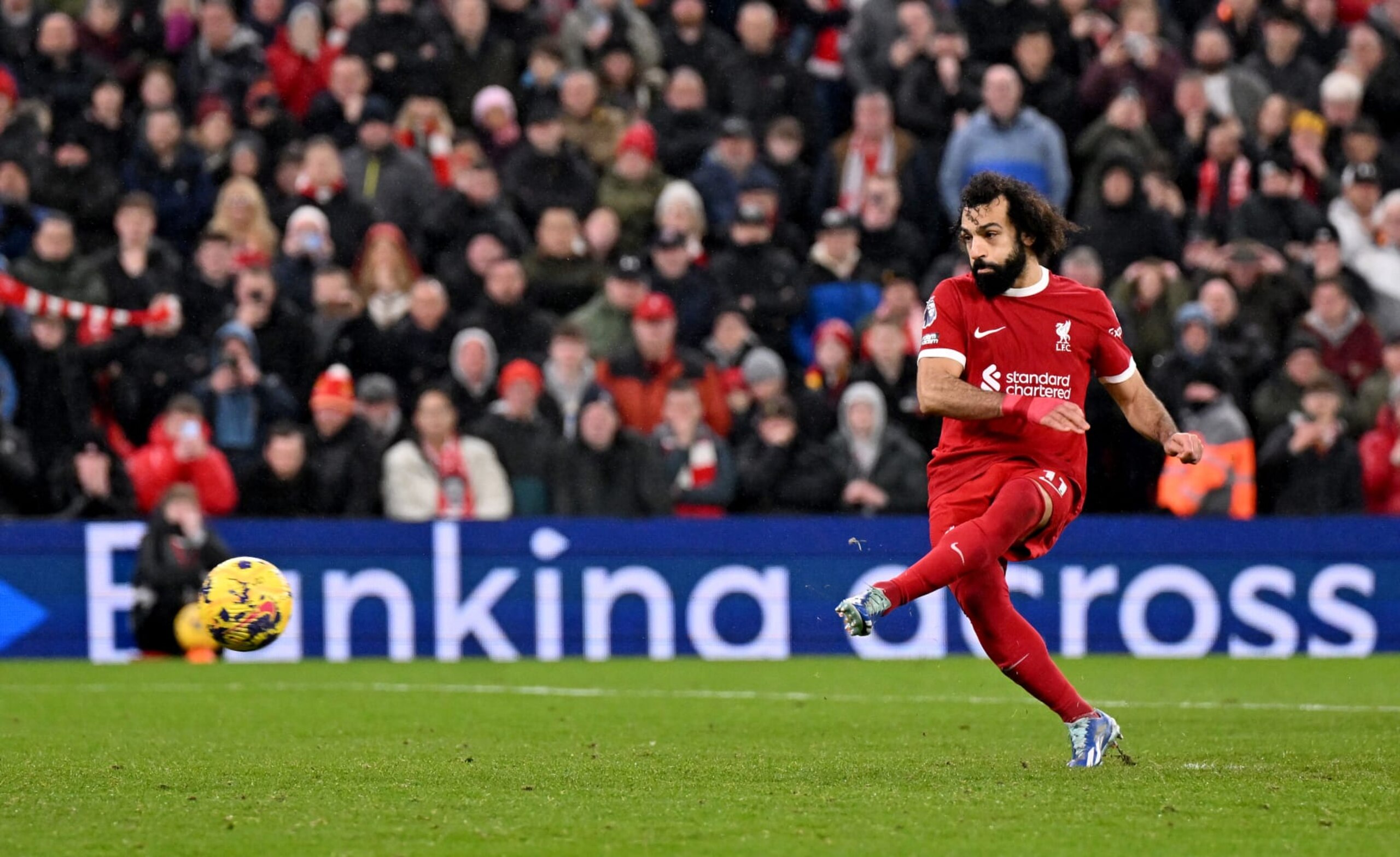 LIVERPOOL, ENGLAND - JANUARY 01: (THE SUN OUT, THE SUN ON SUNDAY OUT) Mohamed Salah of Liverpool scoring the fourth goal making the score 4-2 during the Premier League match between Liverpool FC and Newcastle United at Anfield on January 01, 2024 in Liverpool, England. (Photo by Andrew Powell/Liverpool FC via Getty Images)