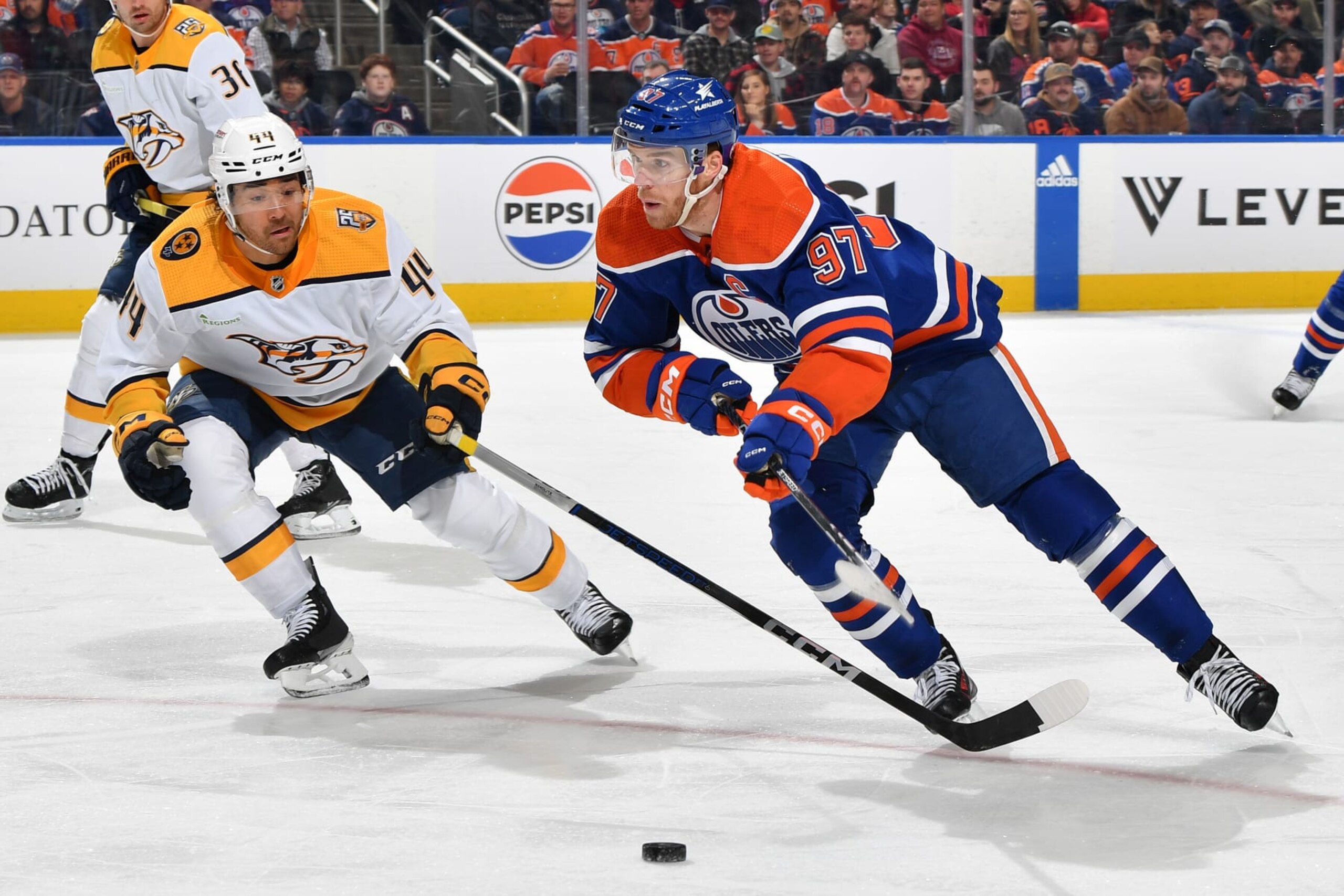 EDMONTON, CANADA - JANUARY 27: Connor McDavid #97 of the Edmonton Oilers skates during the game against Kiefer Sherwood #44 of the Nashville Predators at Rogers Place on January 27, 2024, in Edmonton, Alberta, Canada. (Photo by Andy Devlin/NHLI via Getty Images)