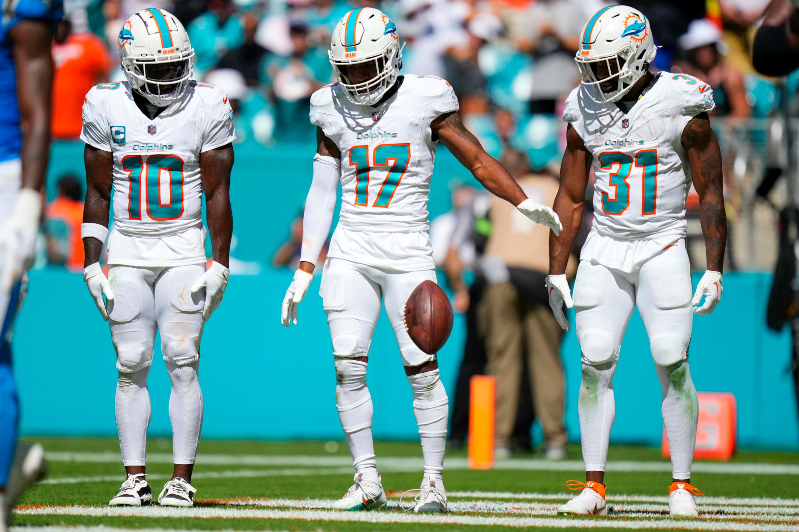 Miami Dolphins WR Tyreek Hill, WR Jaylen Waddle and RB Raheem Mostert