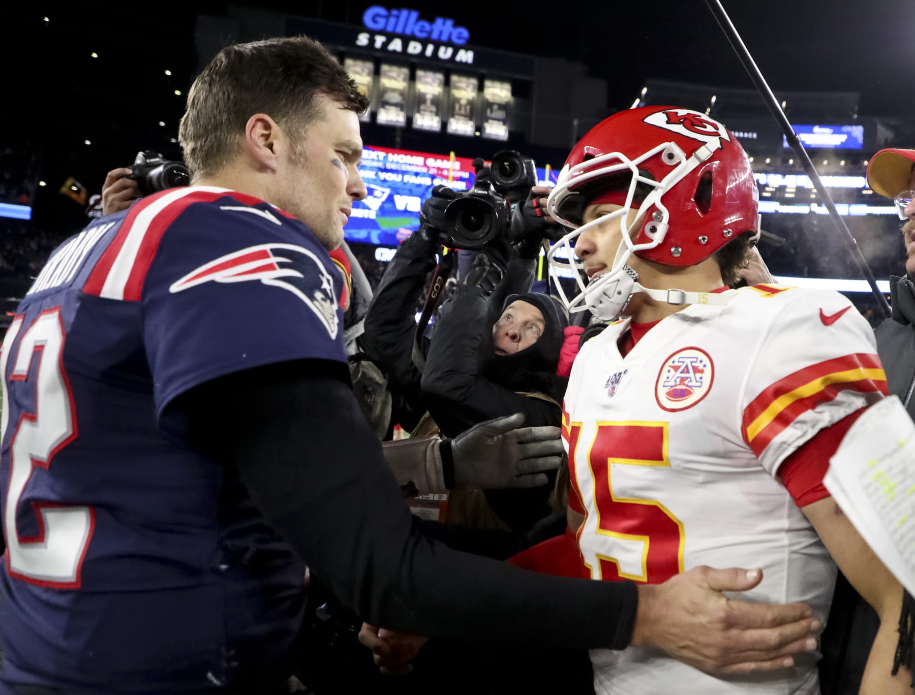 FOXBOROUGH, MA - DECEMBER 8: New England Patriots quarterback Tom Brady shakes hands with Kansas City Chiefs quarterback Patrick Mahomes after the Chief defeated the Patriots, 23-16. The New England Patriots host the Kansas City Chiefs in a regular season NFL football game at Gillette Stadium in Foxborough, MA on Dec. 8, 2019. (Photo by Matthew J. Lee/The Boston Globe via Getty Images)