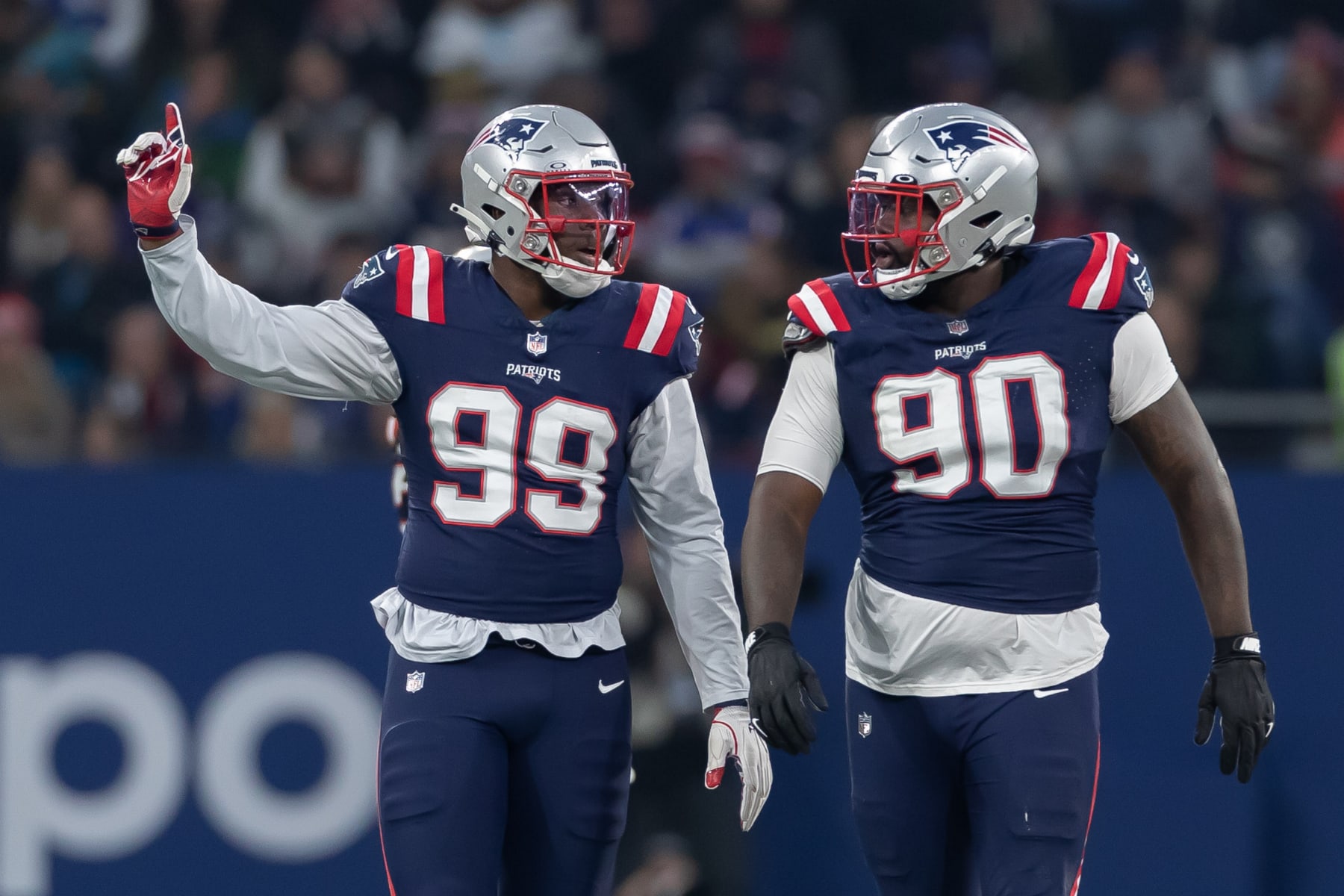New England Patriots DL Keion White and Christian Barmore