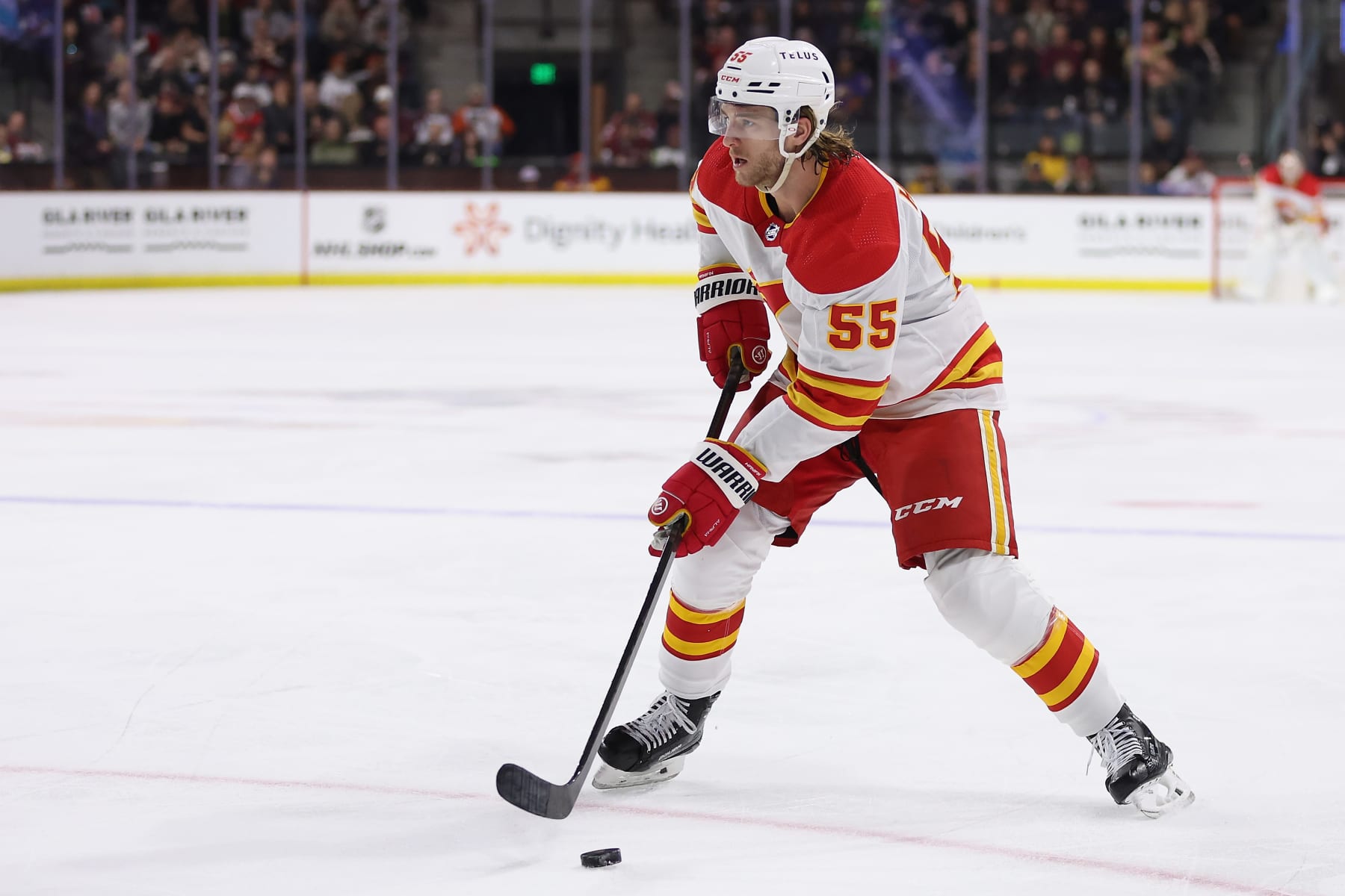 TEMPE, ARIZONA - JANUARY 11: Noah Hanifin #55 of the Calgary Flames skates with the puck during the first period of the NHL game at Mullett Arena on January 11, 2024 in Tempe, Arizona.  (Photo by Christian Petersen/Getty Images)
