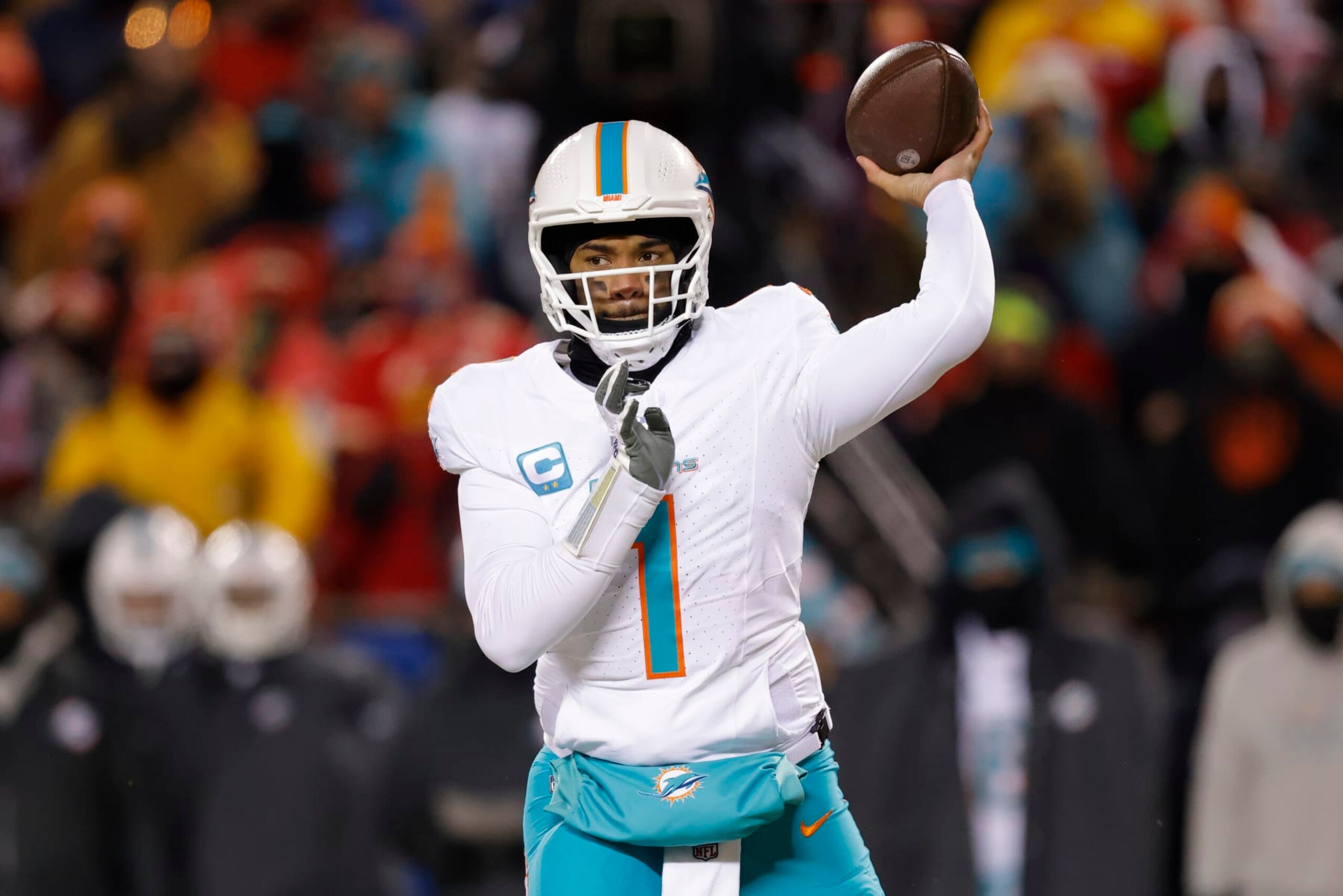 KANSAS CITY, MISSOURI - JANUARY 13: Tua Tagovailoa #1 of the Miami Dolphins throws a pass during the first half against the Kansas City Chiefs in the AFC Wild Card Playoffs at GEHA Field at Arrowhead Stadium on January 13, 2024 in Kansas City, Missouri. (Photo by David Eulitt/Getty Images)