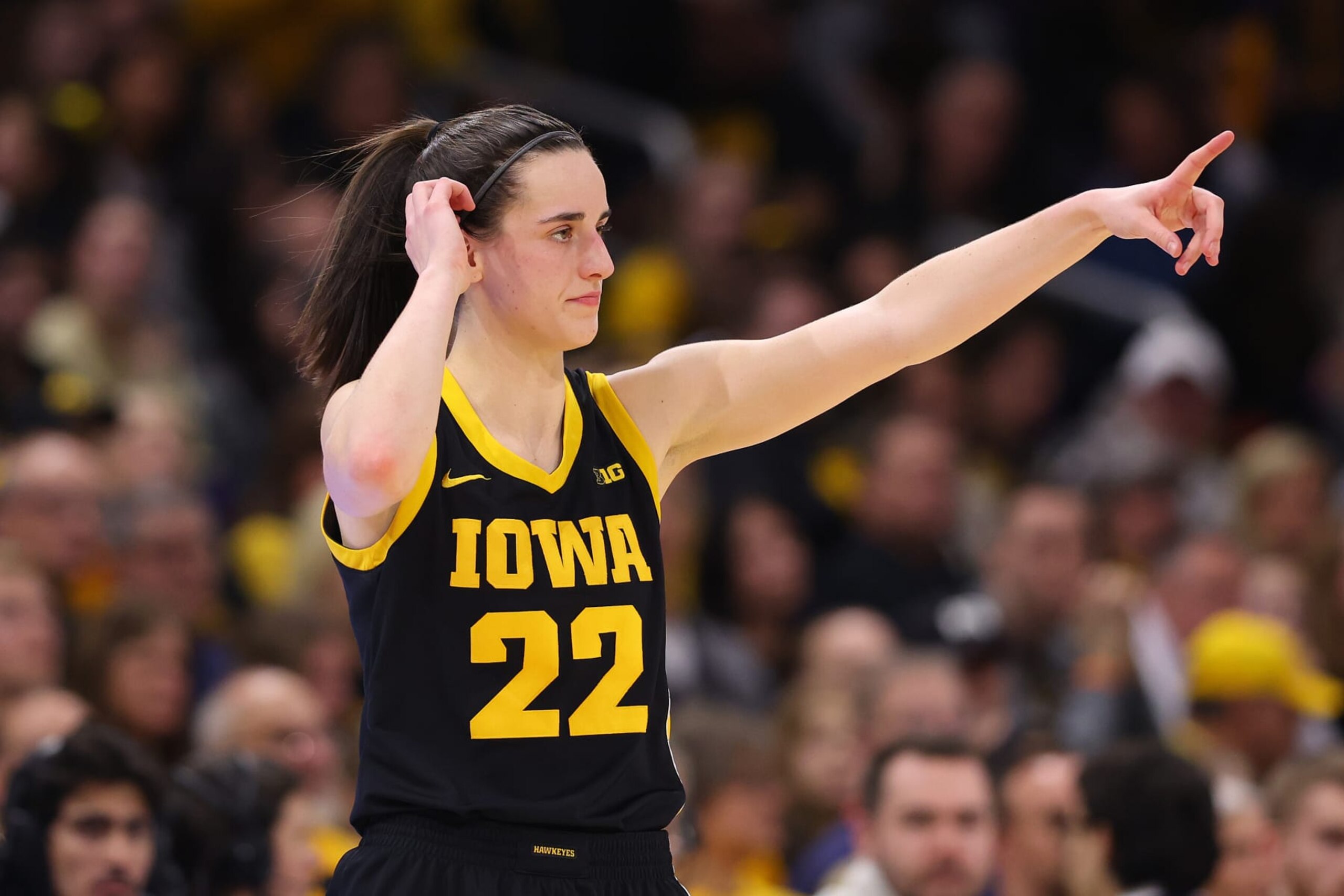 EVANSTON, ILLINOIS - JANUARY 31: Caitlin Clark #22 of the Iowa Hawkeyes directs her teammates against the Northwestern Wildcats during the second half at Welsh-Ryan Arena on January 31, 2024 in Evanston, Illinois. (Photo by Michael Reaves/Getty Images)