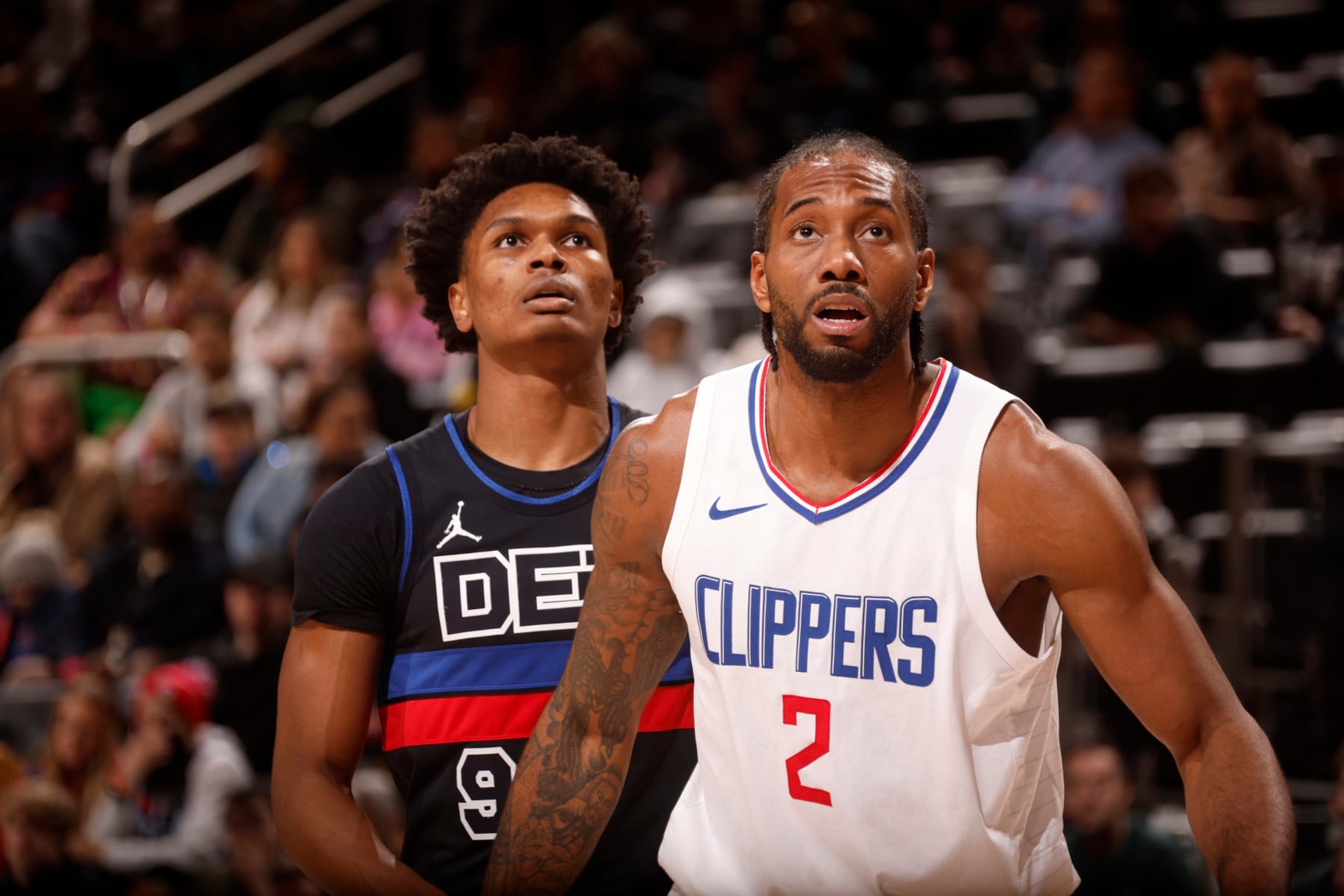 DETROIT, MI - FEBRUARY 2:  Kawhi Leonard #2 of the LA Clippers and Ausar Thompson #9 of the Detroit Pistons looks on during the game on February 2, 2024 at Little Caesars Arena in Detroit, Michigan. NOTE TO USER: User expressly acknowledges and agrees that, by downloading and/or using this photograph, User is consenting to the terms and conditions of the Getty Images License Agreement. Mandatory Copyright Notice: Copyright 2024 NBAE (Photo by Brian Sevald/NBAE via Getty Images)
