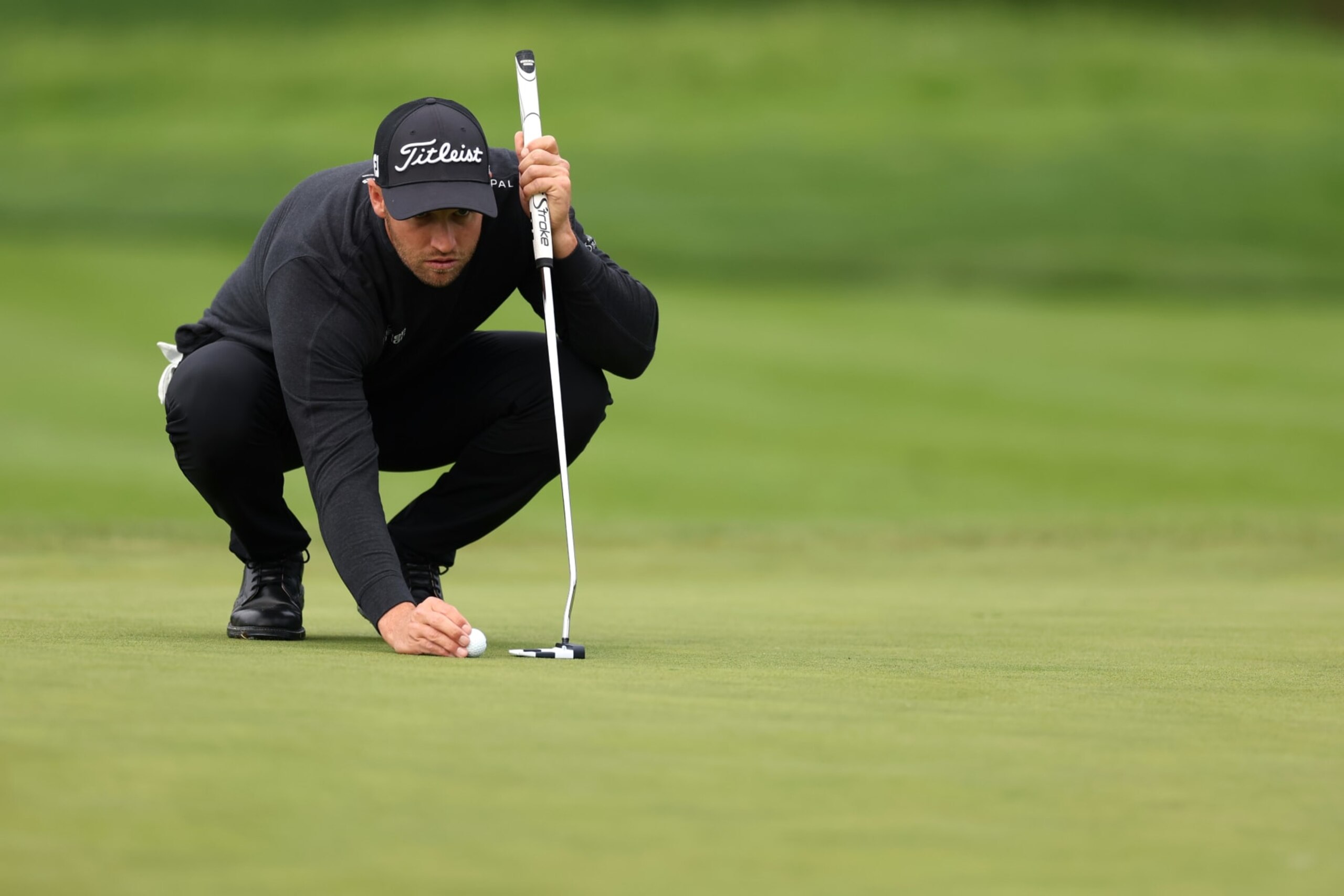 PEBBLE BEACH, CALIFORNIA - FEBRUARY 03: Wyndham Clark of the United States lines up a putt during the AT&T Pebble Beach Pro-Am at Pebble Beach Golf Links on February 03, 2024 in Pebble Beach, California. (Photo by Christian Petersen/Getty Images)