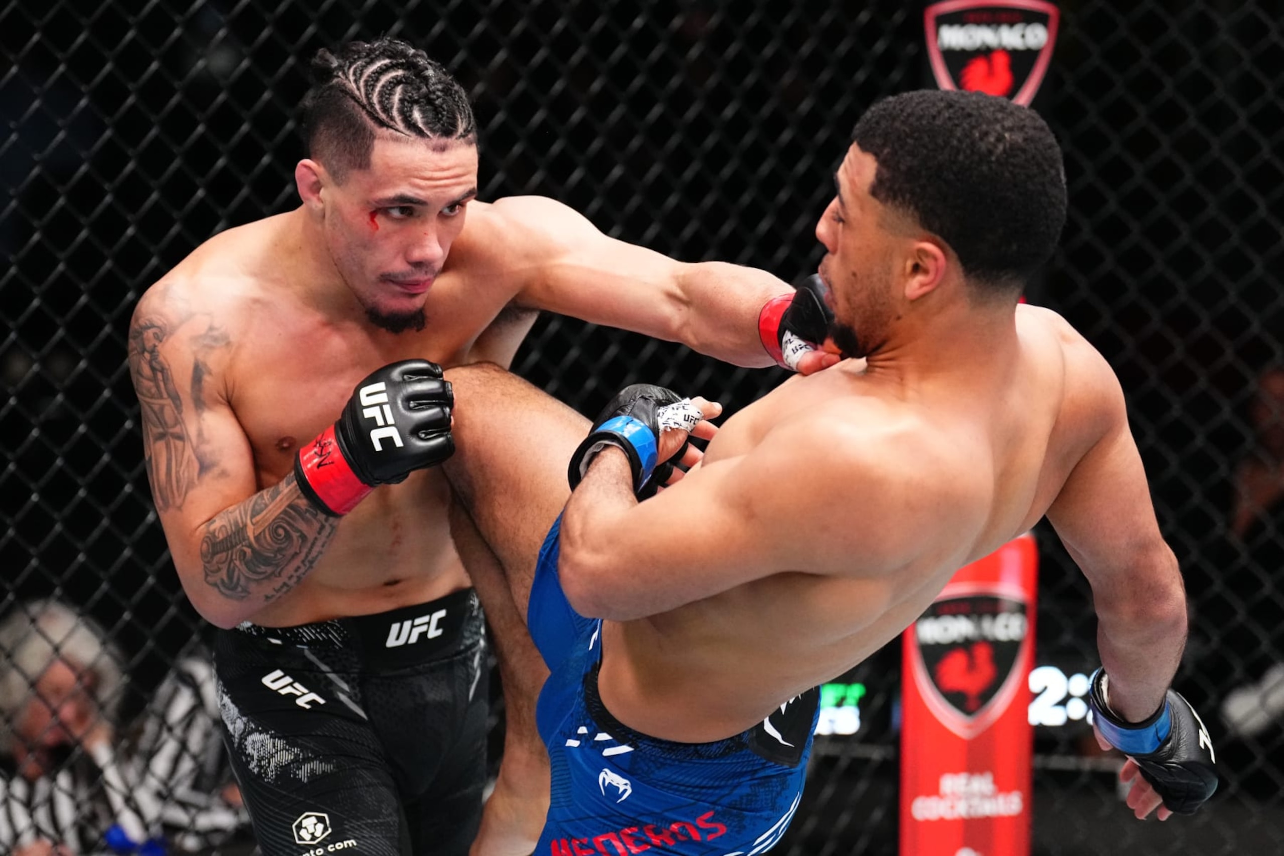 LAS VEGAS, NEVADA - FEBRUARY 03: (L-R) Landon Quinones and MarQuel Mederos trade strikes in a lightweight fight during the UFC Fight Night event at UFC APEX on February 03, 2024 in Las Vegas, Nevada. (Photo by Chris Unger/Zuffa LLC via Getty Images) LAS VEGAS, NEVADA - FEBRUARY 03: (L-R) Landon Quinones and MarQuel Mederos trade strikes in a lightweight fight during the UFC Fight Night event at UFC APEX on February 03, 2024 in Las Vegas, Nevada. (Photo by Chris Unger/Zuffa LLC via Getty Images)