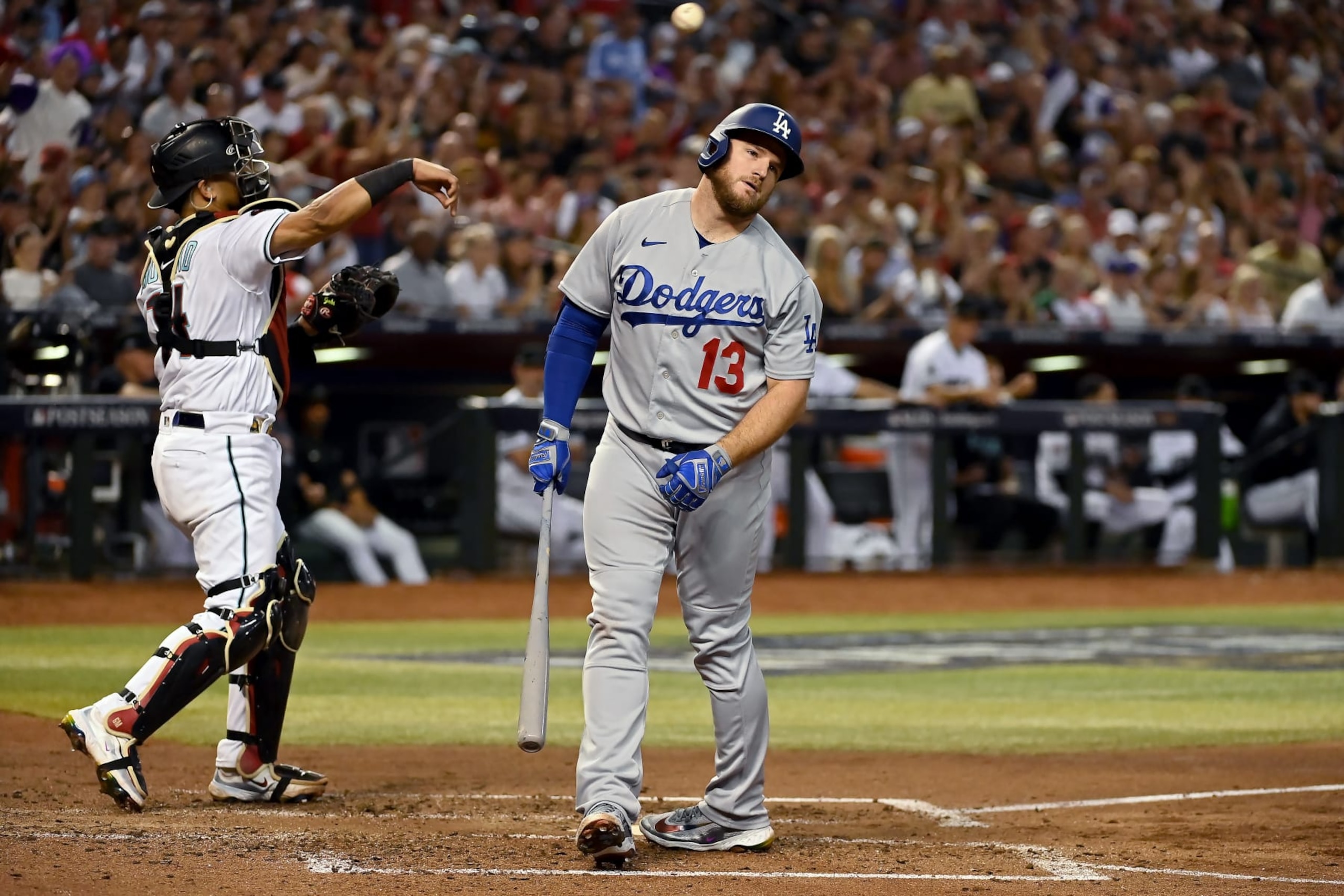 PHOENIX, ARIZONA - OCTOBER 11: Max Muncy #13 of the Los Angeles Dodgers reacts after striking out in the fifth inning against the Arizona Diamondbacks during Game Three of the Division Series at Chase Field on October 11, 2023 in Phoenix, Arizona. (Photo by Norm Hall/Getty Images)