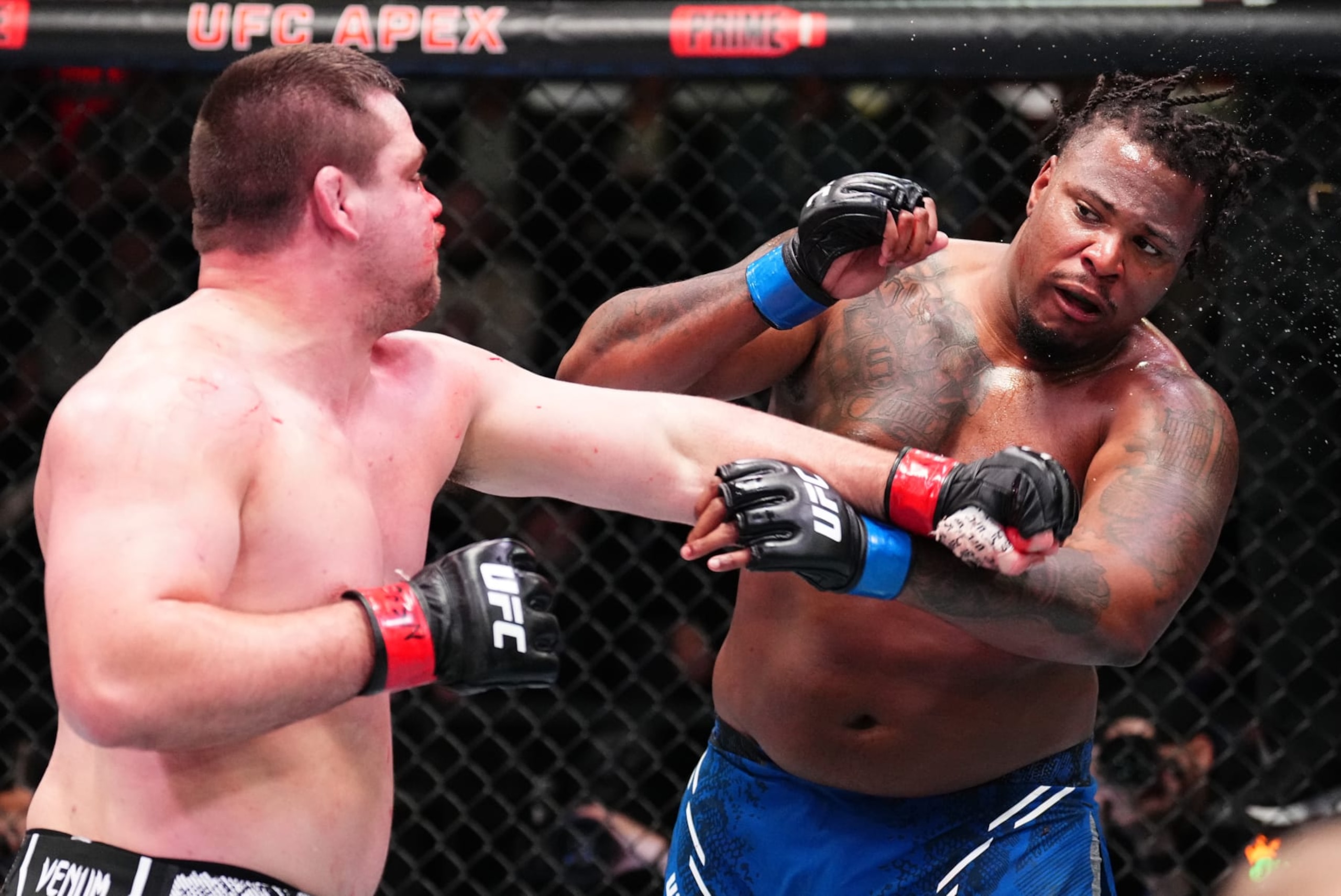 LAS VEGAS, NEVADA - FEBRUARY 03: (L-R) Thomas Petersen punches Jamal Pogues in a heavyweight fight during the UFC Fight Night event at UFC APEX on February 03, 2024 in Las Vegas, Nevada. (Photo by Chris Unger/Zuffa LLC via Getty Images) LAS VEGAS, NEVADA - FEBRUARY 03: (L-R) Thomas Petersen punches Jamal Pogues in a heavyweight fight during the UFC Fight Night event at UFC APEX on February 03, 2024 in Las Vegas, Nevada. (Photo by Chris Unger/Zuffa LLC via Getty Images)