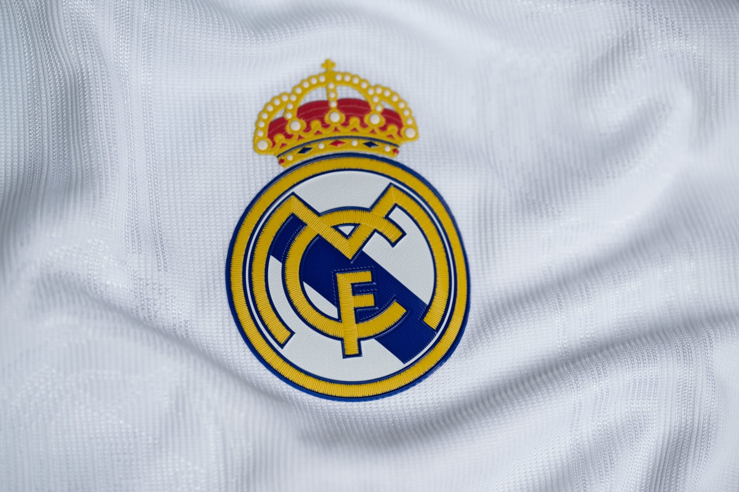 NYON, SWITZERLAND - OCTOBER 3: A detailed view of the badge of Real Madrid CF during the UEFA Champions League 2022/23 Group Stage Teams Jerseys Shoot at UEFA Headquarters, The House of the European Football, on October 3, 2022, in Nyon, Switzerland. (Photo by Kristian Skeie - UEFA/UEFA via Getty Images)