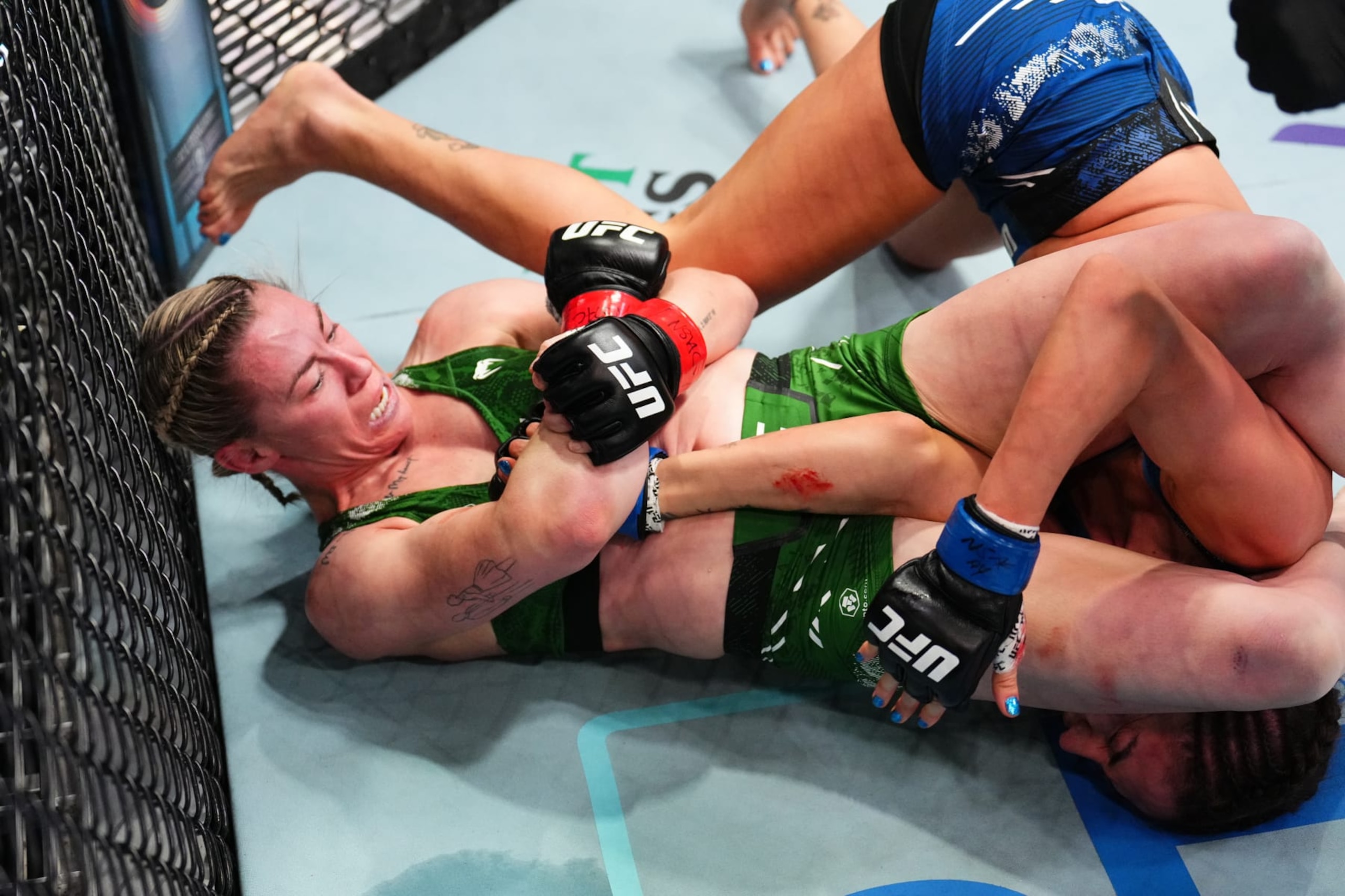LAS VEGAS, NEVADA - FEBRUARY 03: (L-R) Molly McCann of England secures an arm bar submission against Diana Belbita of Romania in a strawweight fight during the UFC Fight Night event at UFC APEX on February 03, 2024 in Las Vegas, Nevada. (Photo by Chris Unger/Zuffa LLC via Getty Images) LAS VEGAS, NEVADA - FEBRUARY 03: (L-R) Molly McCann of England secures an arm bar submission against Diana Belbita of Romania in a strawweight fight during the UFC Fight Night event at UFC APEX on February 03, 2024 in Las Vegas, Nevada. (Photo by Chris Unger/Zuffa LLC via Getty Images)