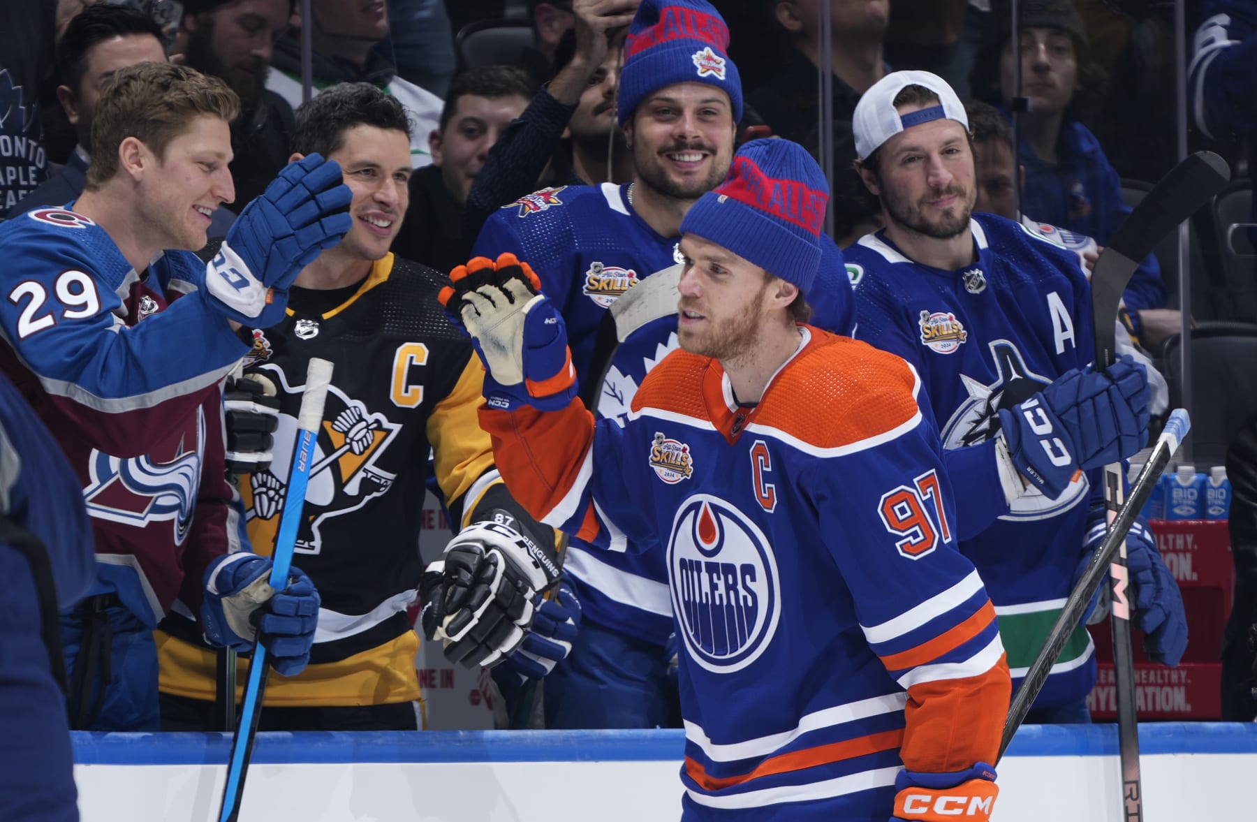 TORONTO, ONTARIO - FEBRUARY 02: Connor McDavid #97 of the Edmonton Oilers gets high fives from the bench after competing in the Pepsi NHL Obstacle Course competition during the 2024 NHL All-Star Skills Competition at Scotiabank Arena on February 02, 2024 in Toronto, Ontario, Canada. (Photo by Mark Blinch/NHLI via Getty Images)